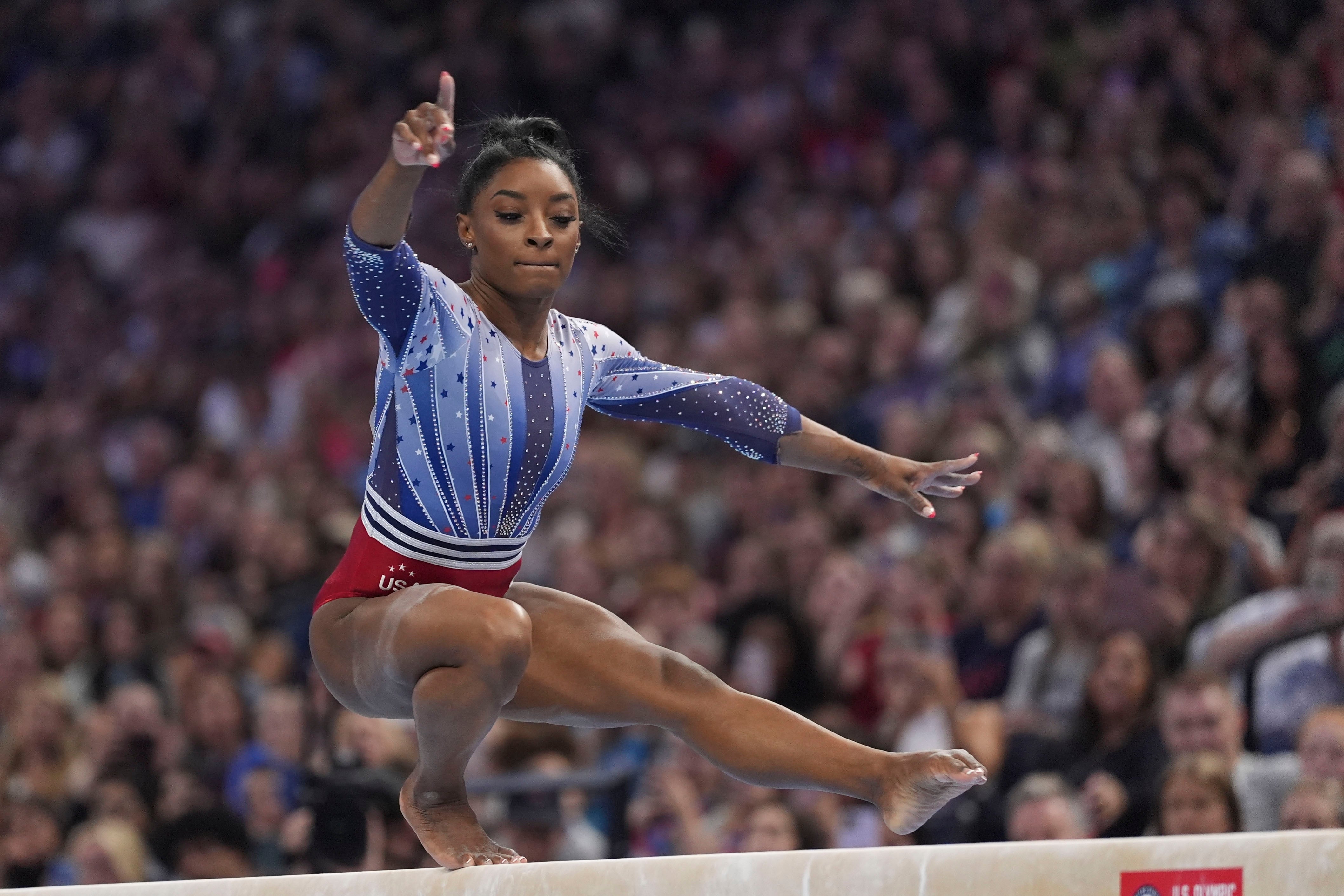 Simone Biles competes on the balance beam at the US Olympic Gymnastics Trials on Friday, June 28, 2024, in Minneapolis.