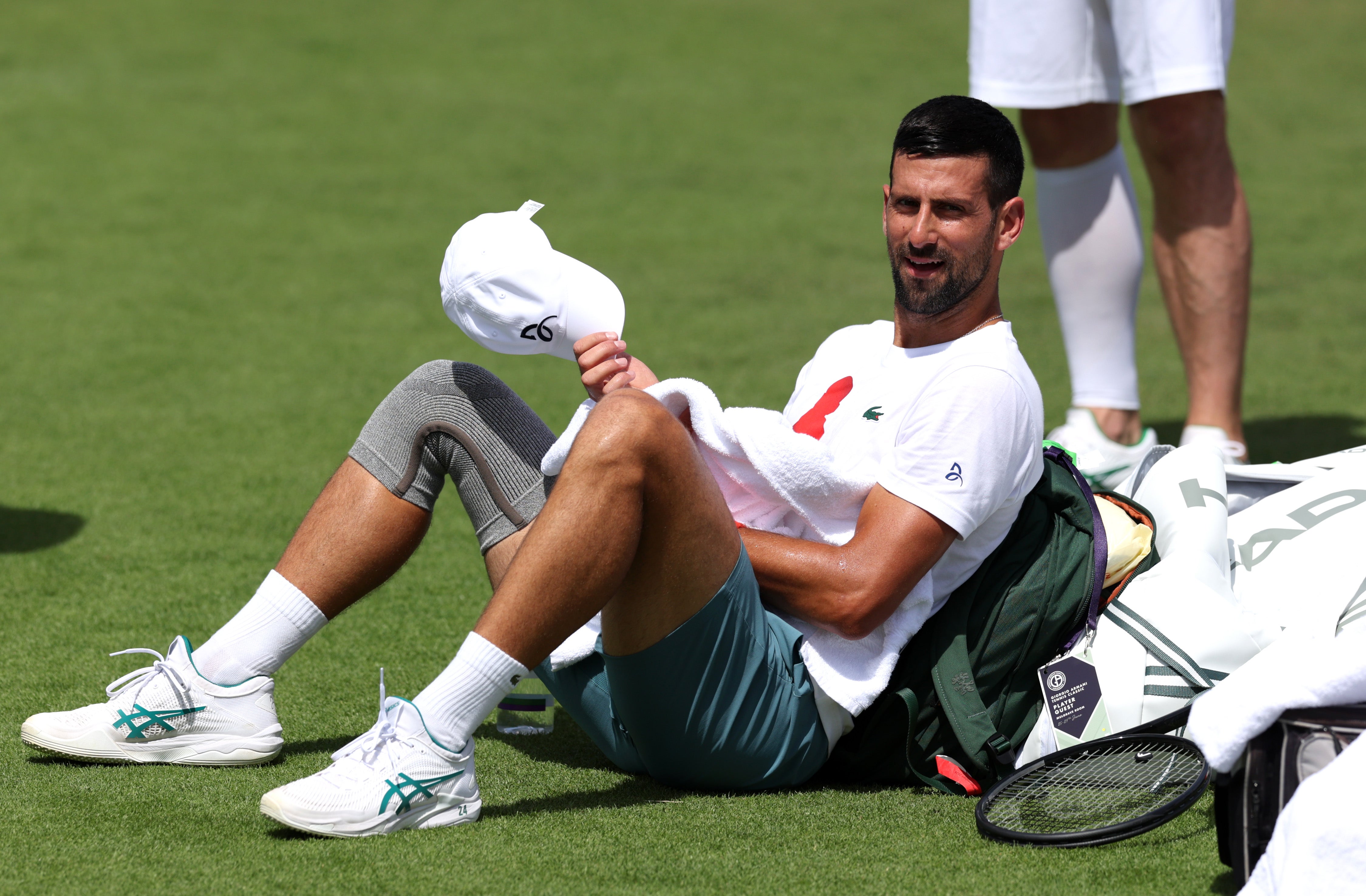 Novak Djokovic takes a break during practice at Wimbledon