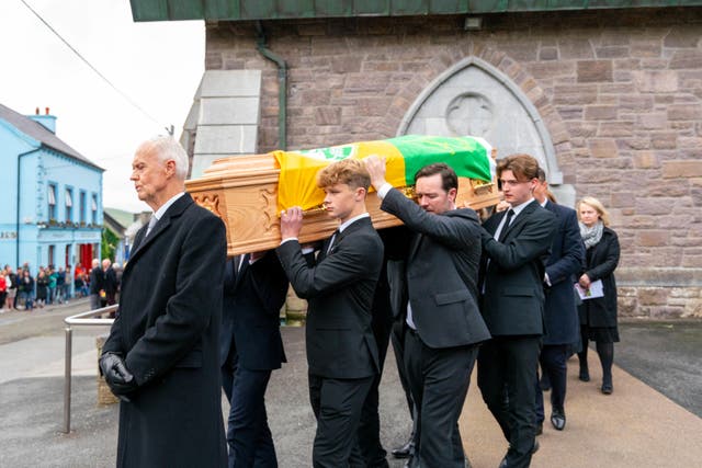 The coffin is brought from St Mary’s Church in Dingle, Co Kerry following the funeral of renowned Gaelic Games commentator Micheal O Muircheartaigh at St Mary’s Church in Dingle, Co Kerry (Noel Sweeney/PA)