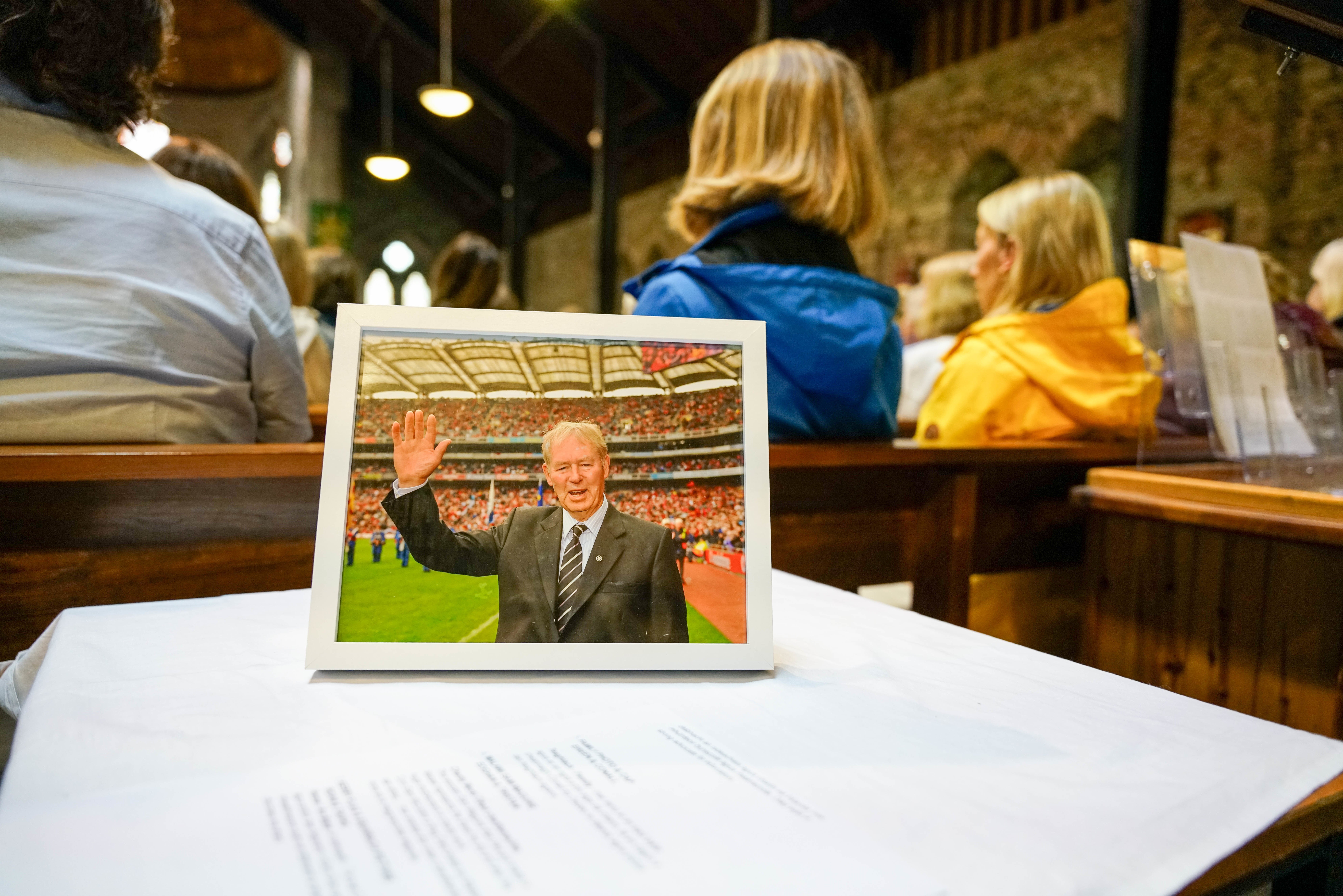 The photo on display during the funeral of Micheal O Muircheartaigh at St Mary’s Church in Dingle, Co Kerry (Noel Sweeney/PA)