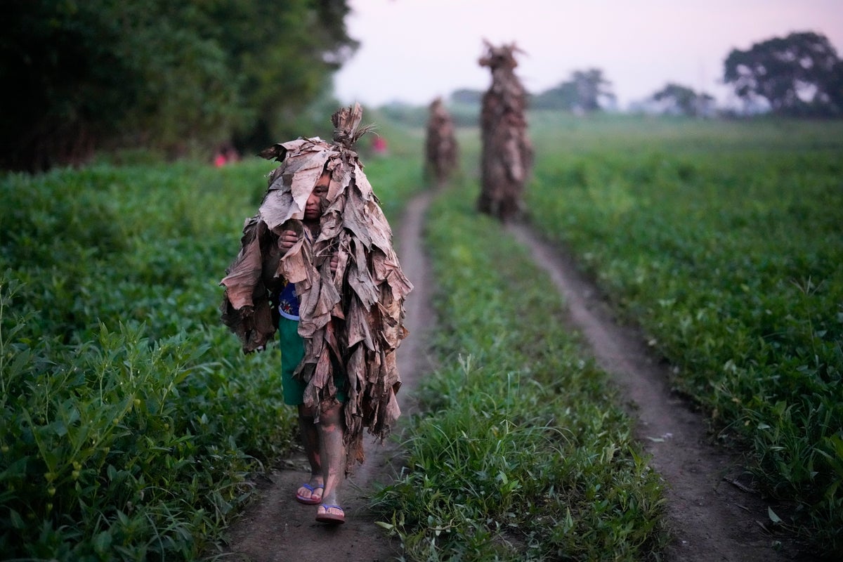 An AP Photographer picked his own path when trying to make the perfect Mud People Festival photo