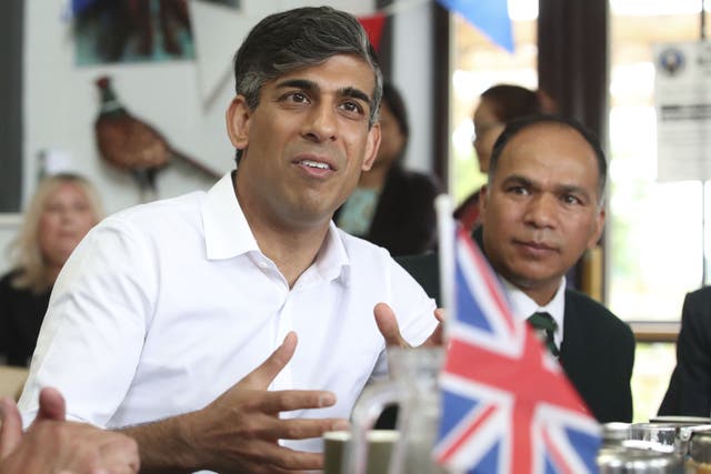 <p>Rishi Sunak meets former members of the armed forces at a cafe on Armed Forces Day in his Richmond and Northallerton constituency</p>
