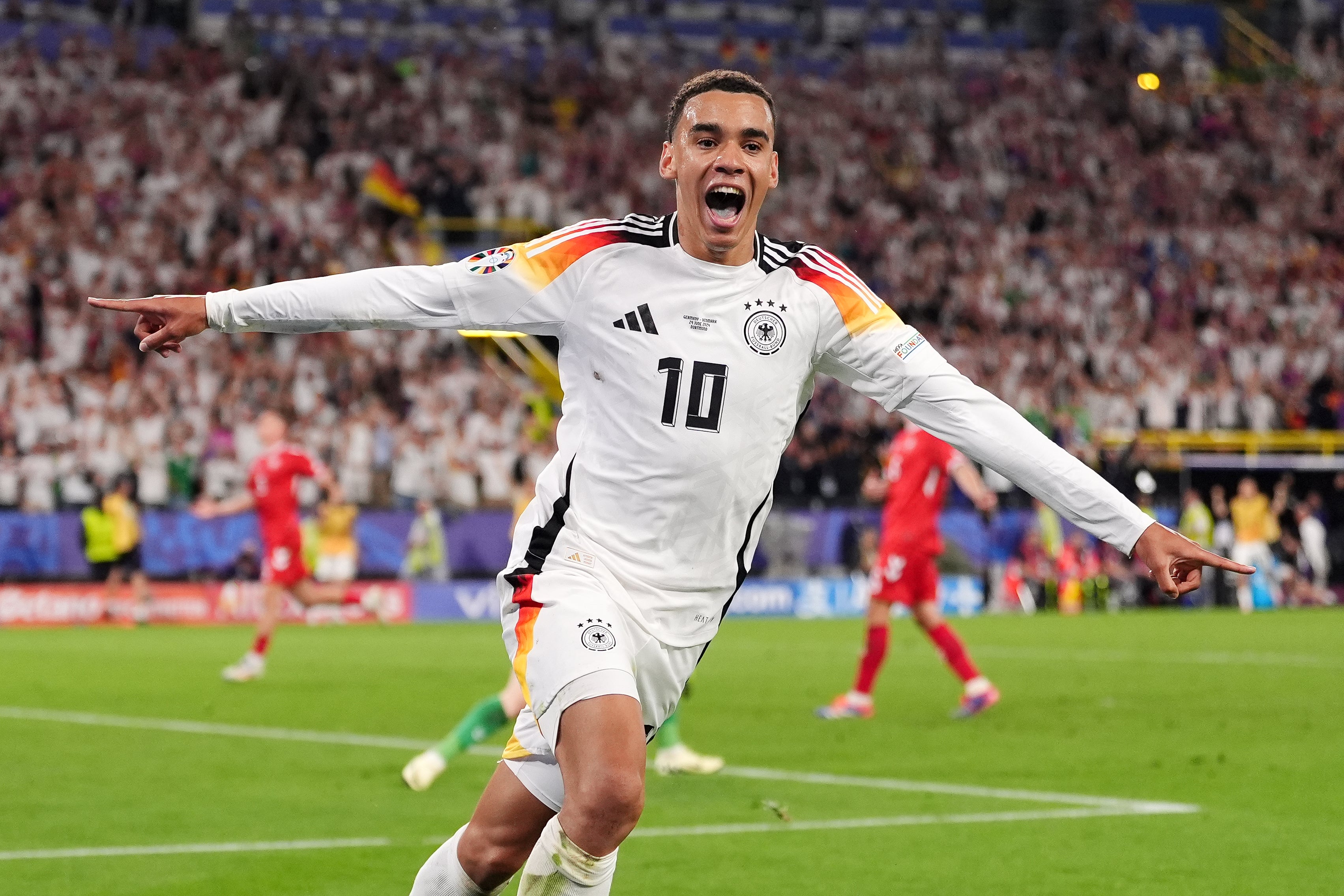 Jamal Musiala celebrates scoring Germany’s second goal against Denmark, his third of the tournament