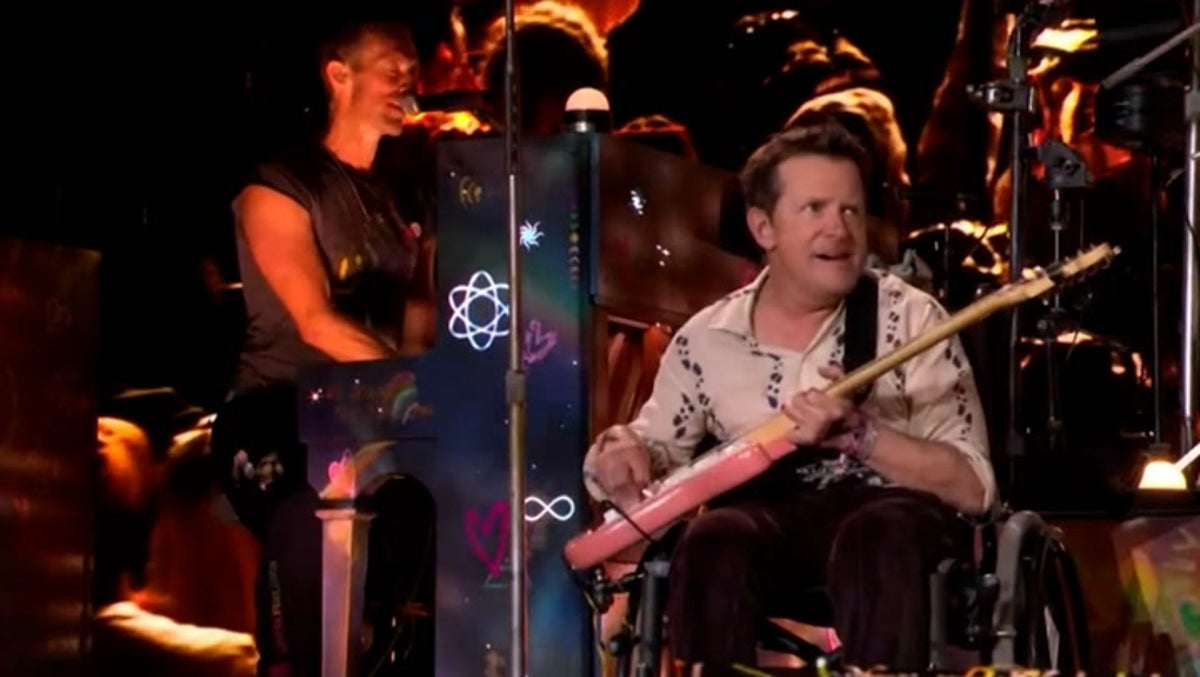 Michael J. Fox joins Coldplay to perform on Glastonbury stage as Chris Martin reveals how actor helped form band
