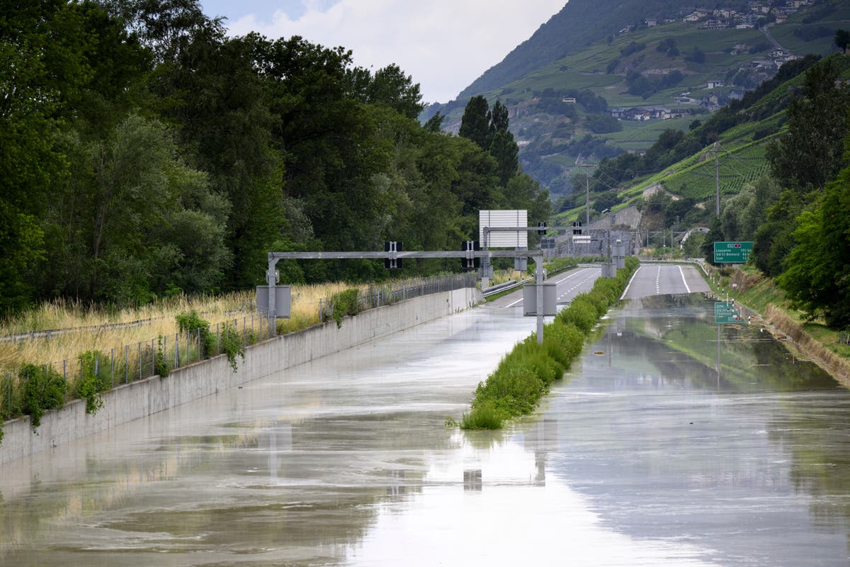 Storms in Switzerland cause flooding and a landslide that left at least 2 people dead