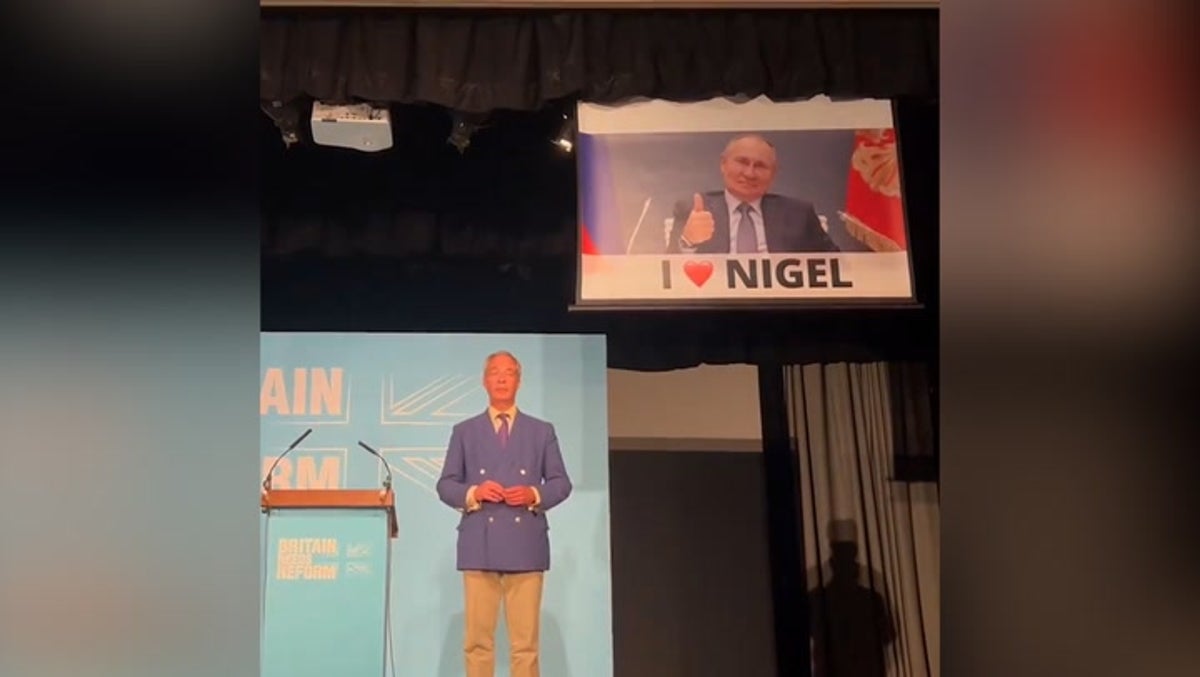 Watch moment Led by Donkeys interrupt Nigel Farage’s speech with huge Putin banner