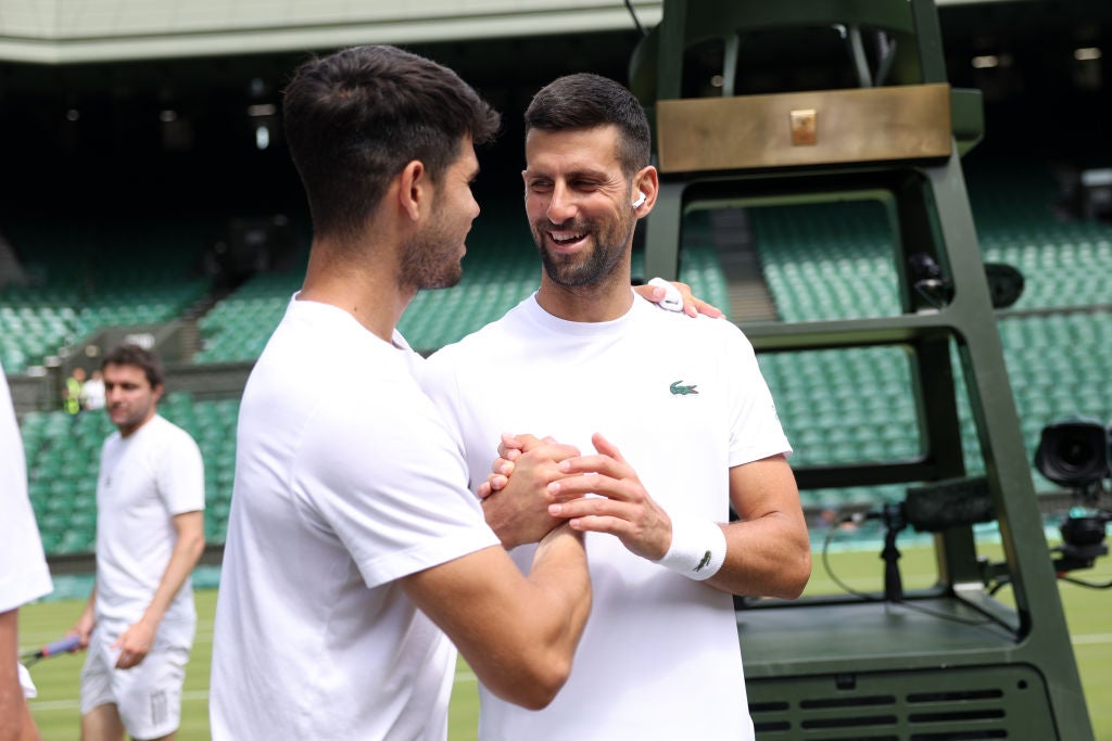 Carlos Alcaraz and Novak Djokovic ahead of this year’s Wimbledon, where the Spaniard lifted the title 12 months ago