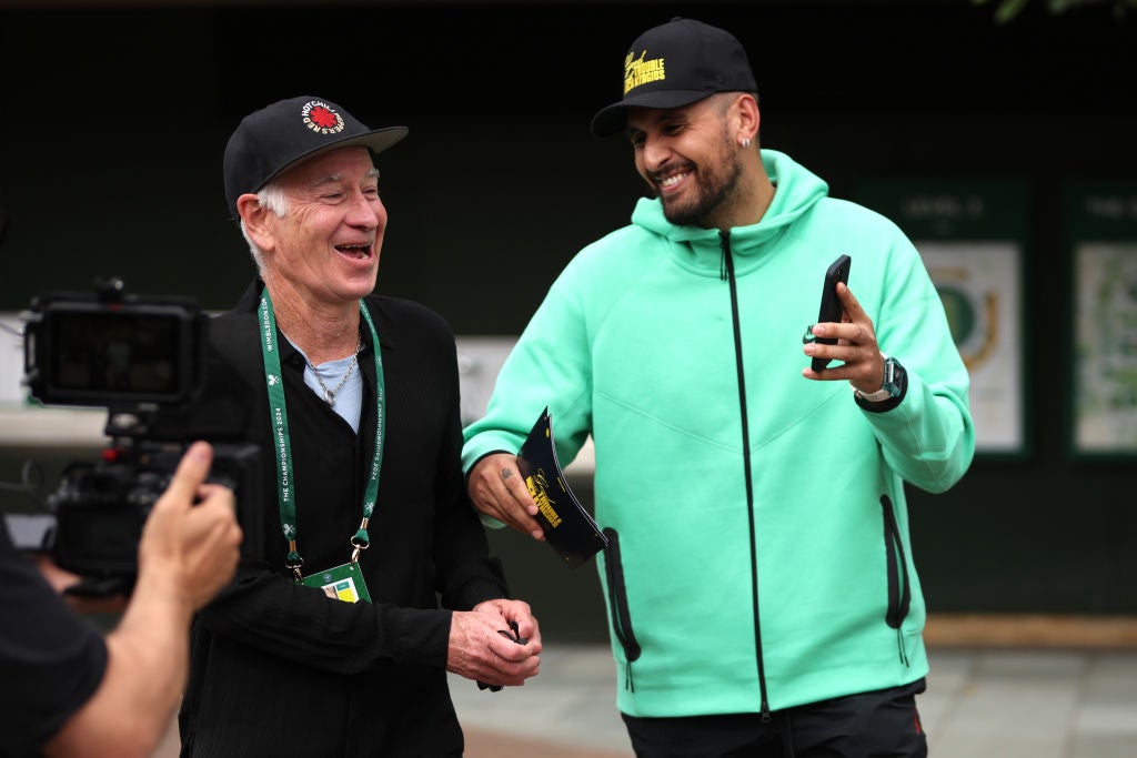 Nick Kyrgios, right, with John McEnroe at Wimbledon
