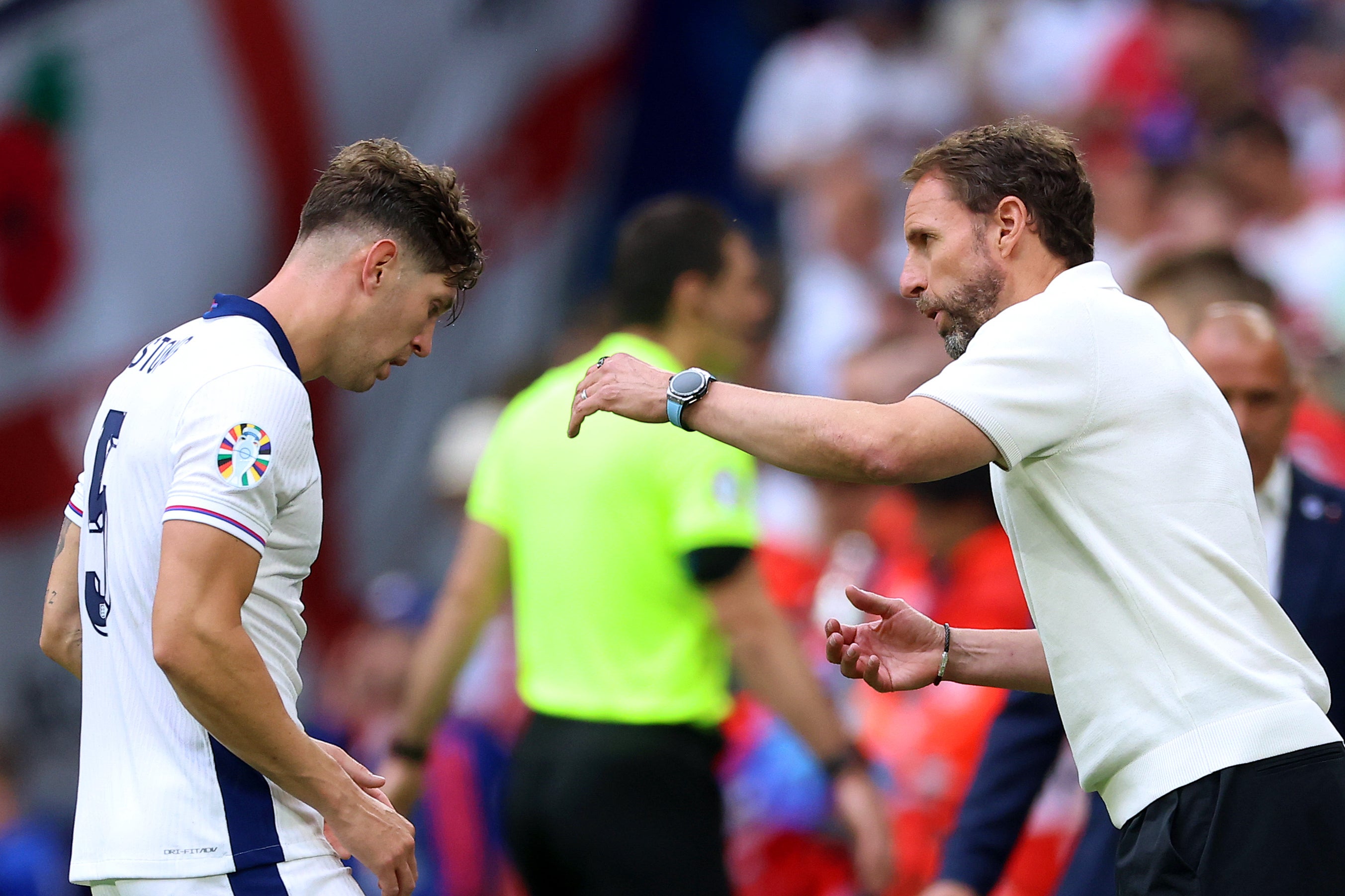 Gareth Southgate (right) discussing tactics with England centre-back John Stones