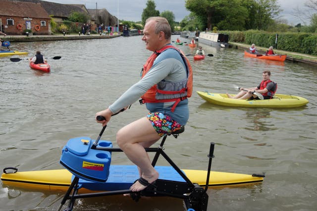 Liberal Democrat leader Sir Ed Davey uses an aqua-bike on the River Cherwell (Jacob Freedland/PA)