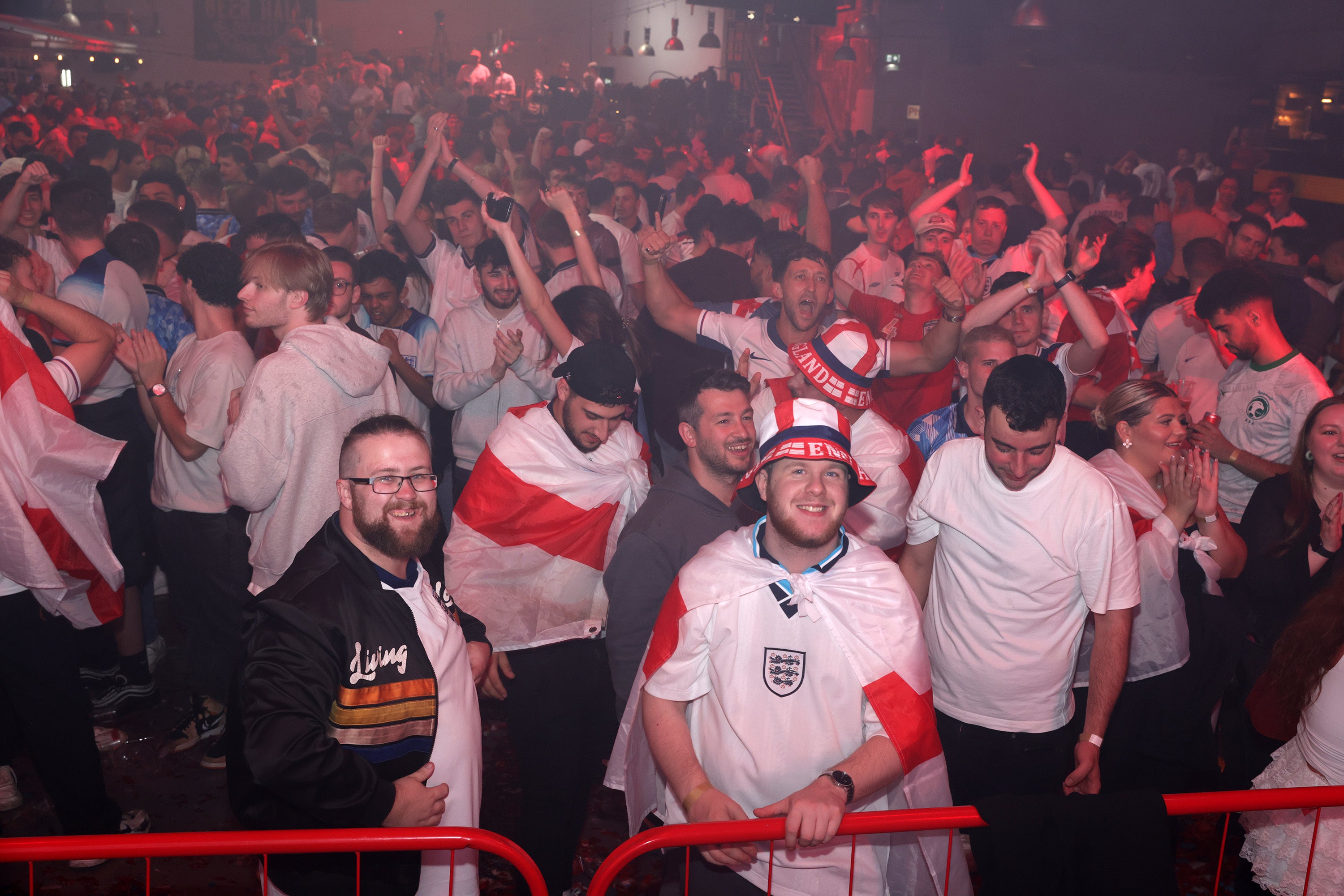England fans celebrate at full-time at the Diecast, Manchester (Ian Hodgson/PA)