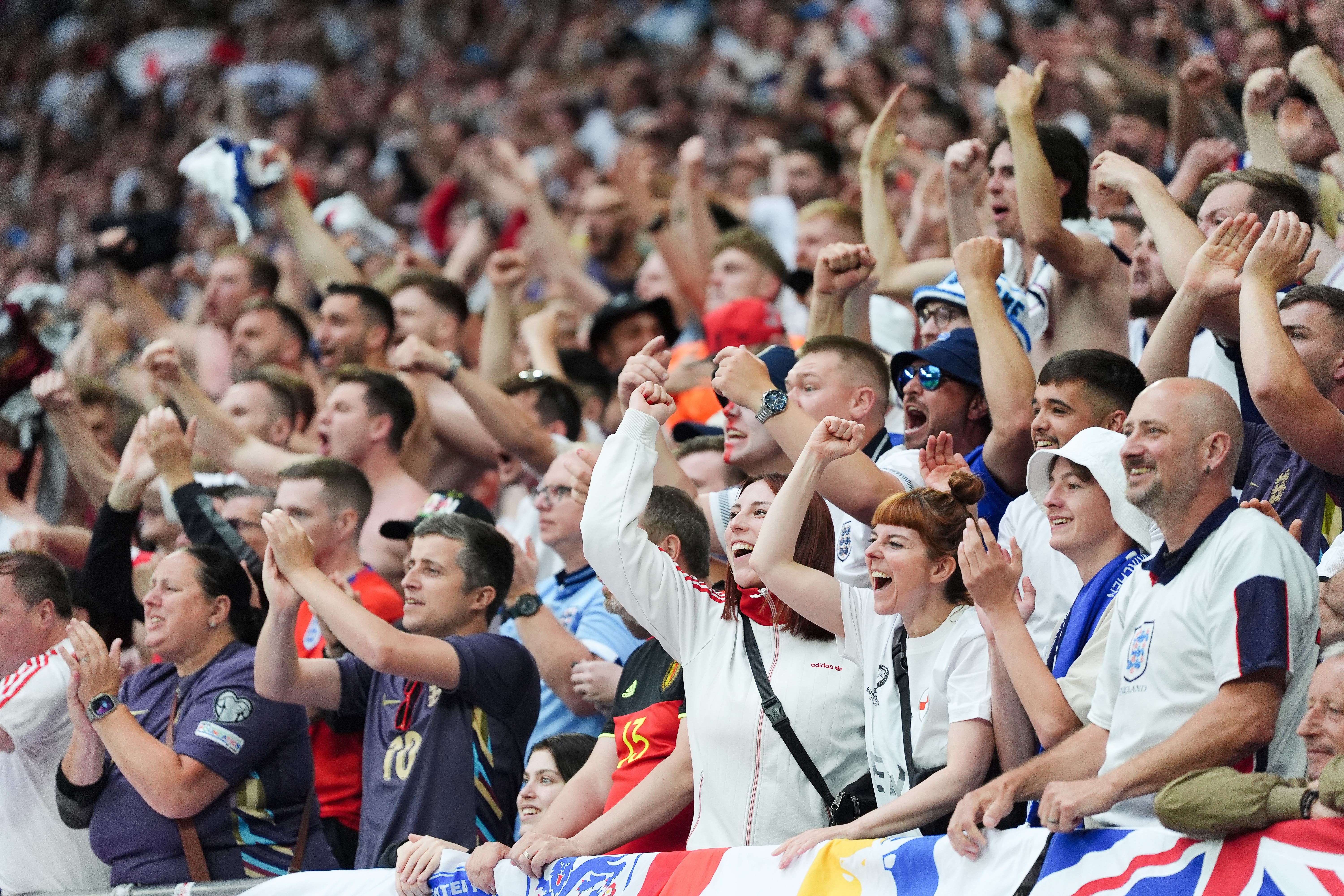 England fans celebrates after Jude Bellingham scores (PA)