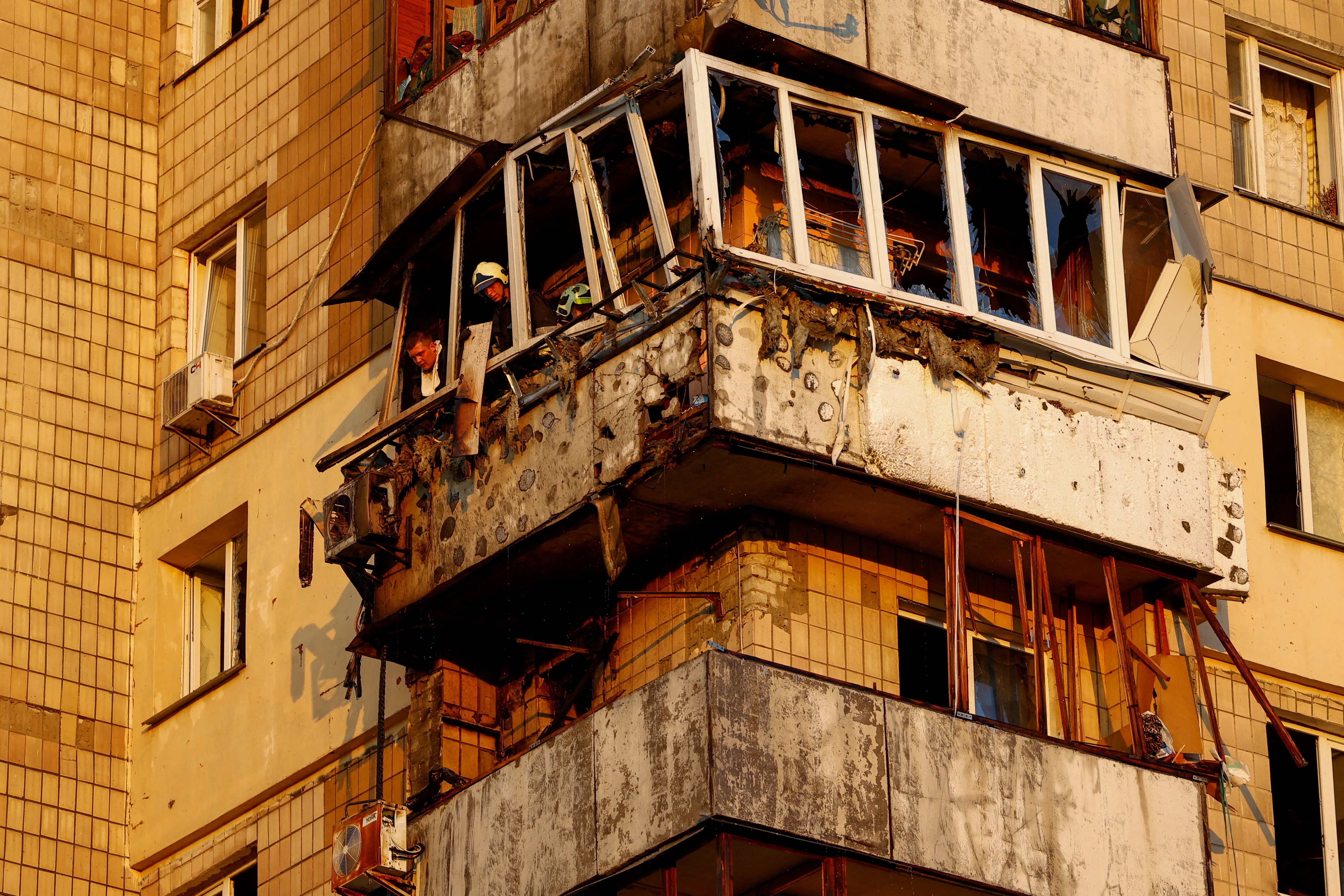 Rescues work in an apartment building damaged during a Russian missile strike, amid Russia's attack on Ukraine, in Kyiv