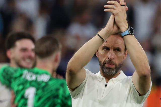 <p>England manager Gareth Southgate applauds the fans after Sunday’s 2-1 win over Slovakia in Gelsenkirchen  </p>
