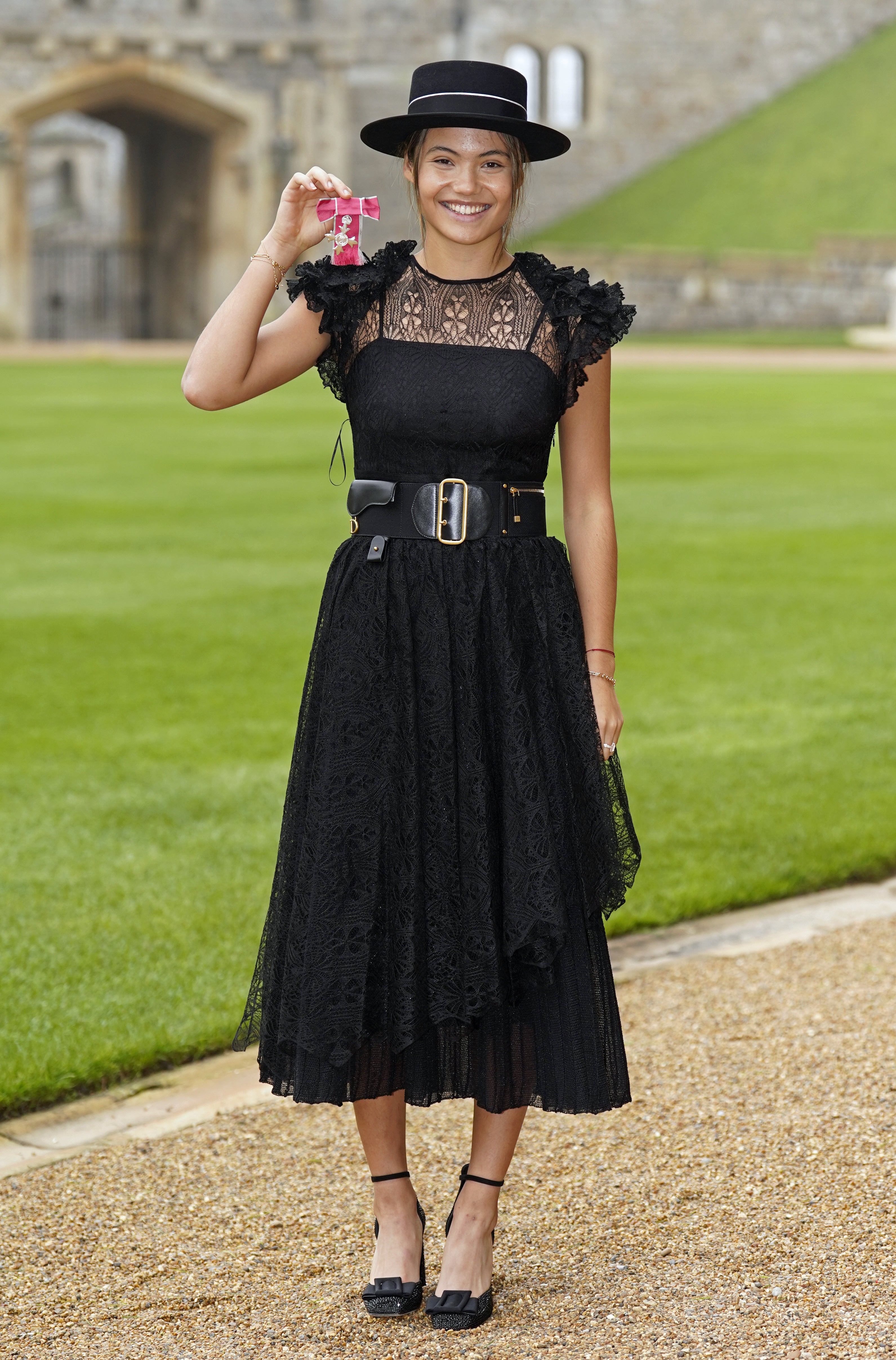 Raducanu combined classic and contemporary in a Dior dress as she collected her MBE (Andrew Matthews/PA)