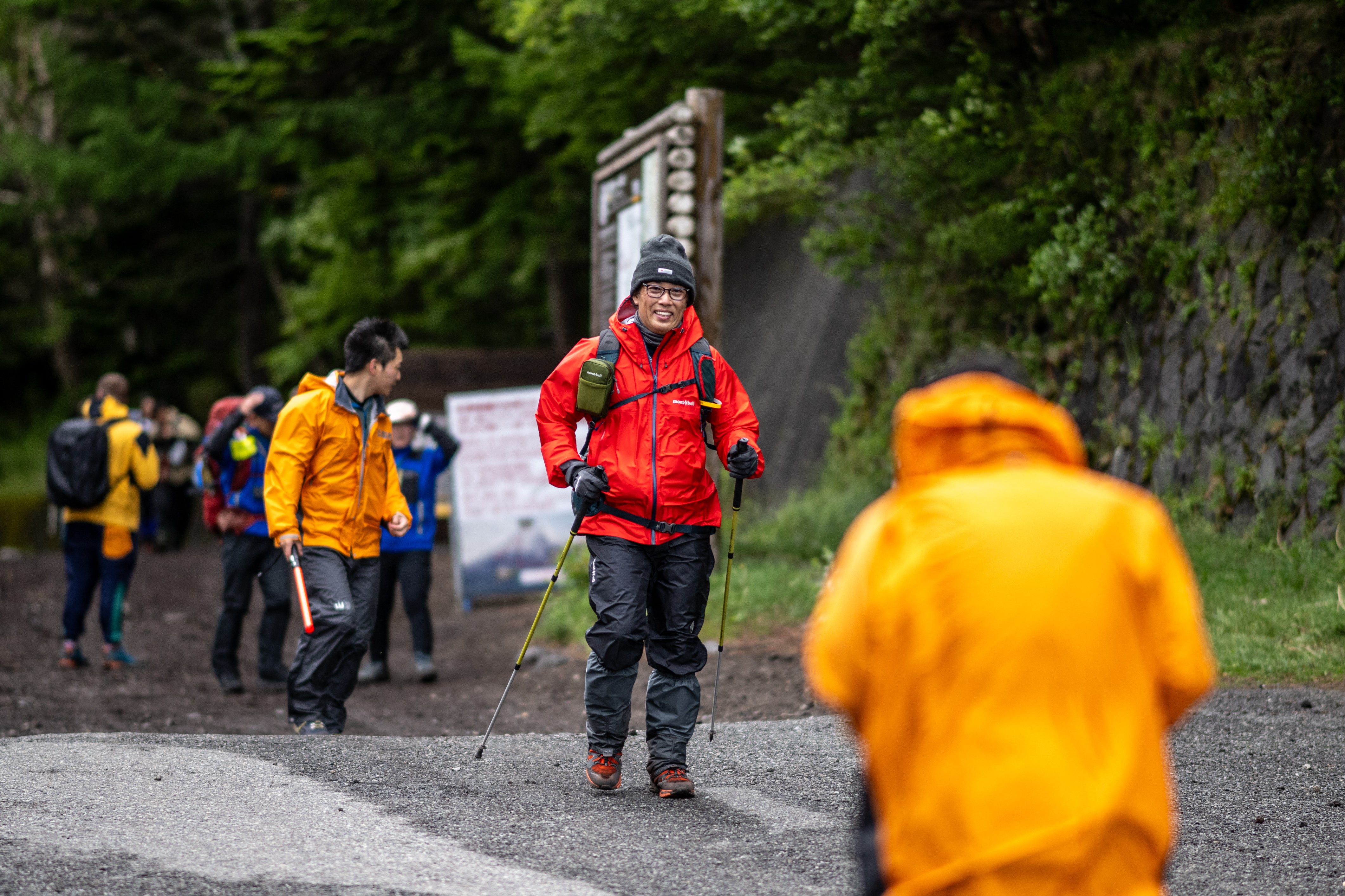 Hikers walk out from the newly installed gate at Fuji Subaru Line 5th station on their way to Mount Fuji on the first day of the new climbing season at Narusawa in Yamanashi prefecture