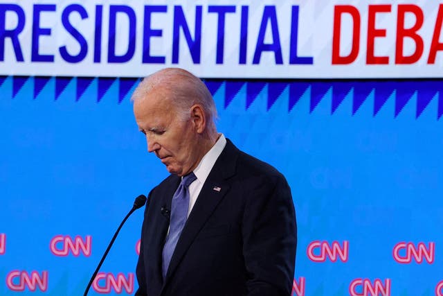 <p>Joe Biden looks down at his notes during the presidential debate in June 2024. </p>
