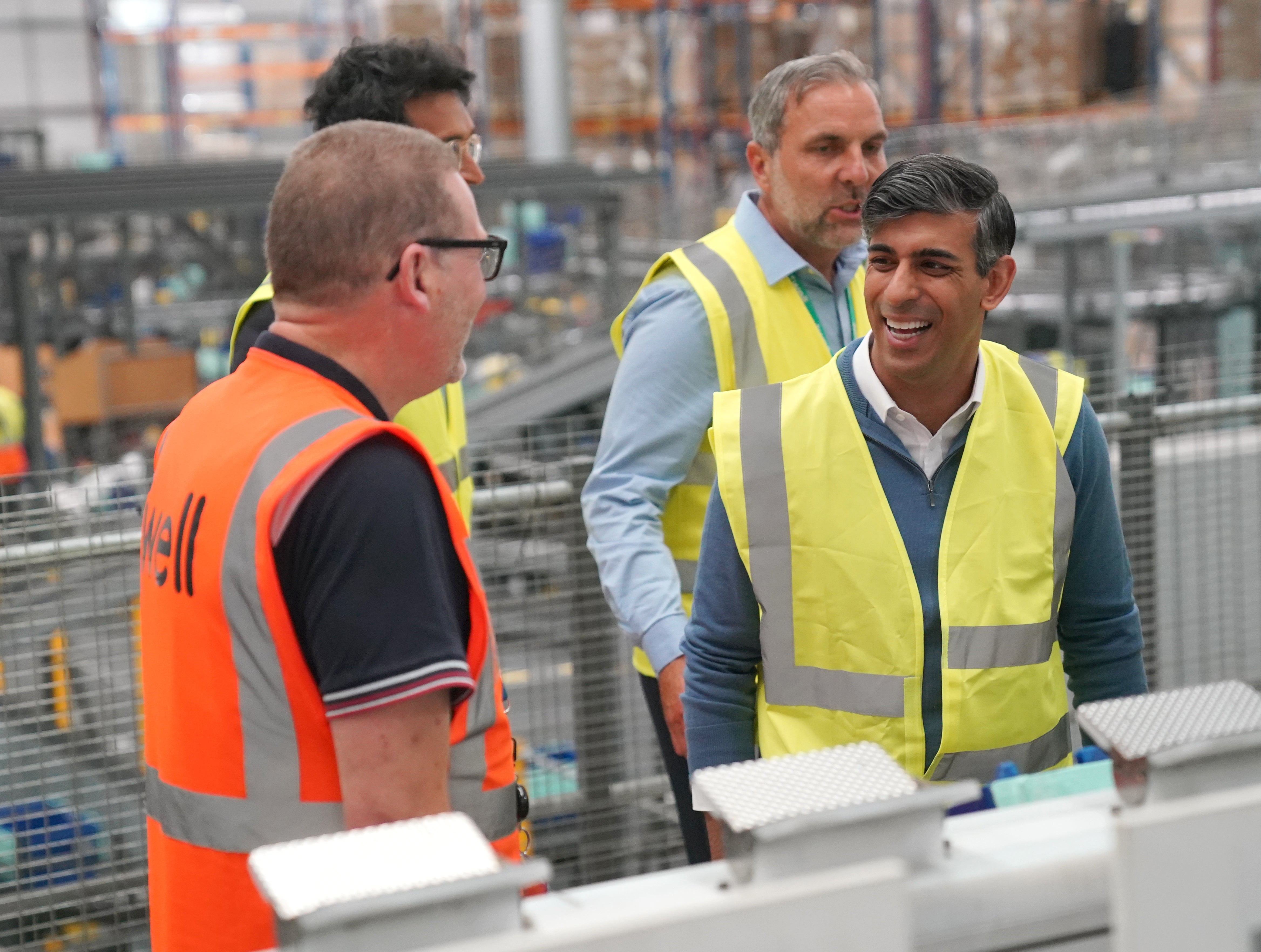 Prime Minister Rishi Sunak on a campaign visit to a pharmaceutical packing and distribution centre in Stoke-on-Trent (Jonathan Brady/PA)