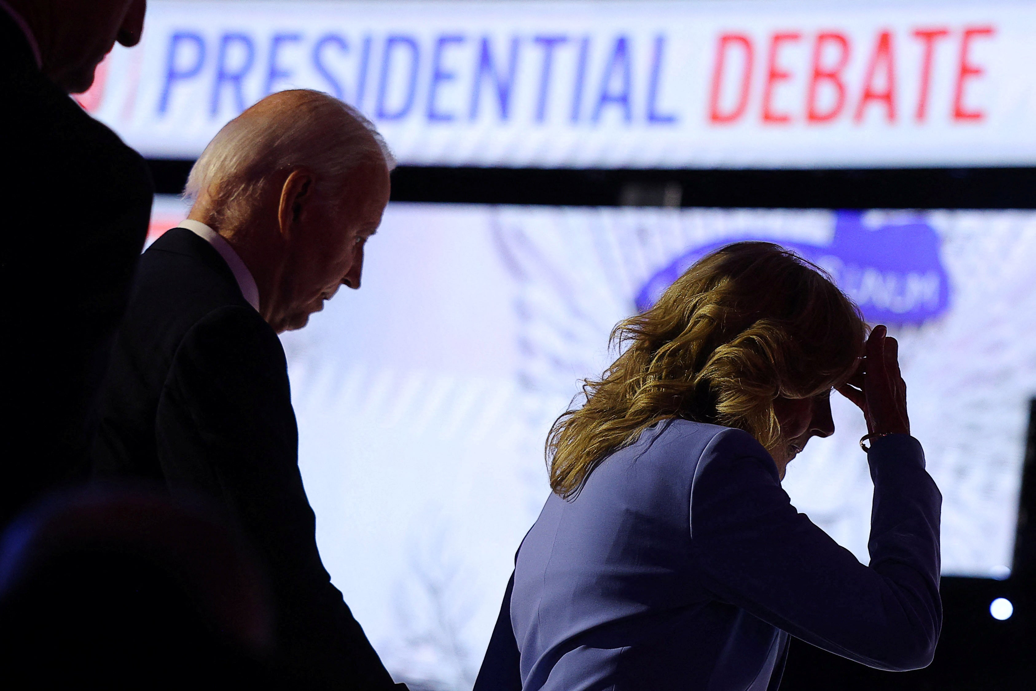 Joe Biden and First Lady Jill Biden leave the CNN presidential debate stage on June 27