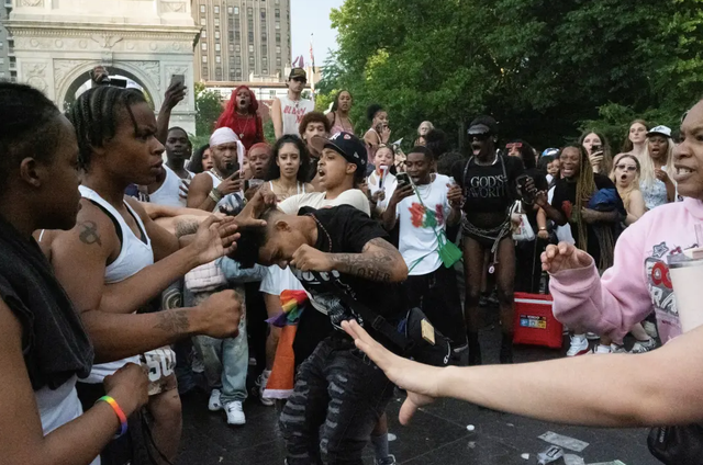 <p>Revelers fight each other during Pride in Washington Square Park in New York City on June 30, 2024</p>