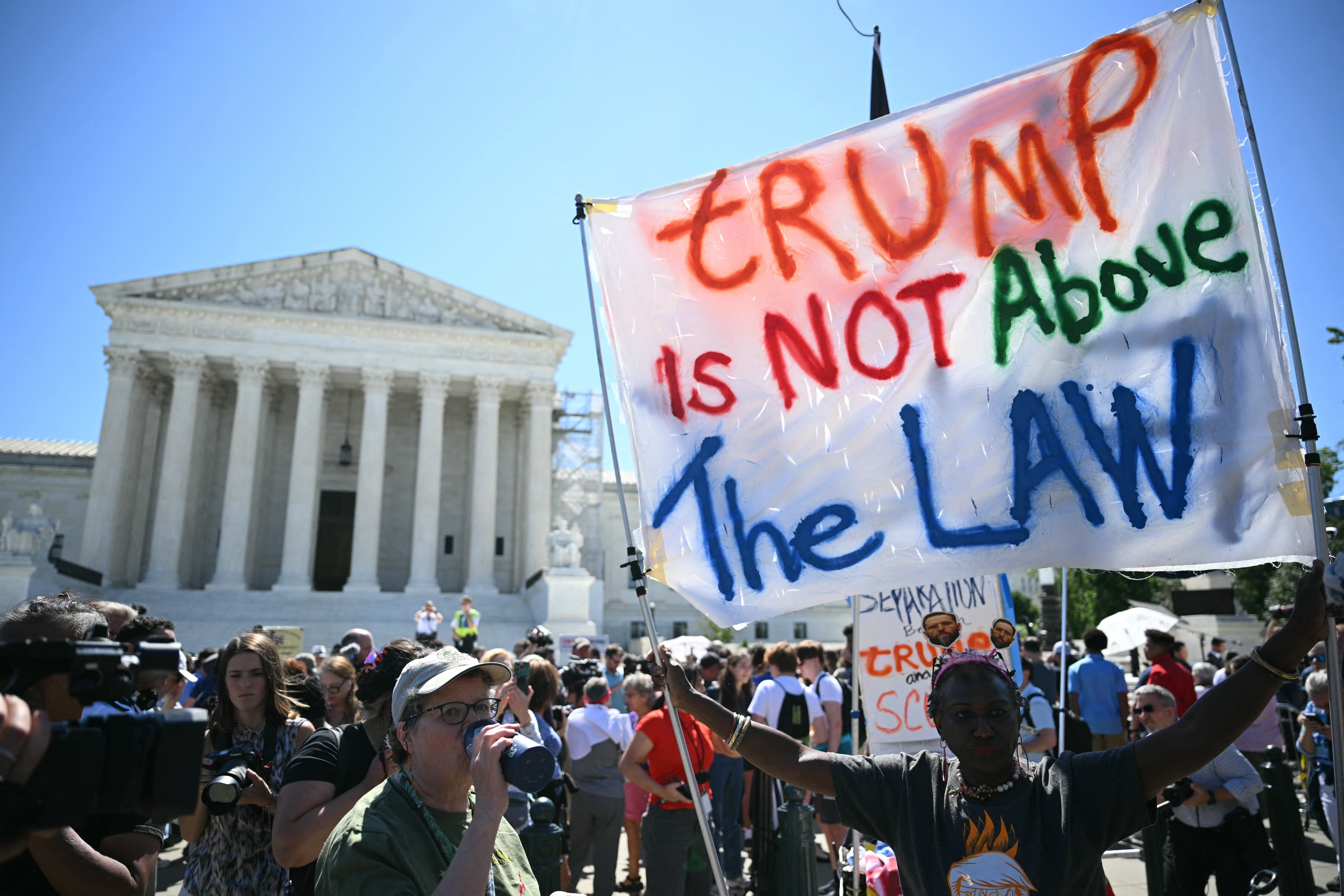 Protesters gather outside the Supreme Court on July 1 as justices grant Donald Trump partial immunity from prosecution in his election interference case