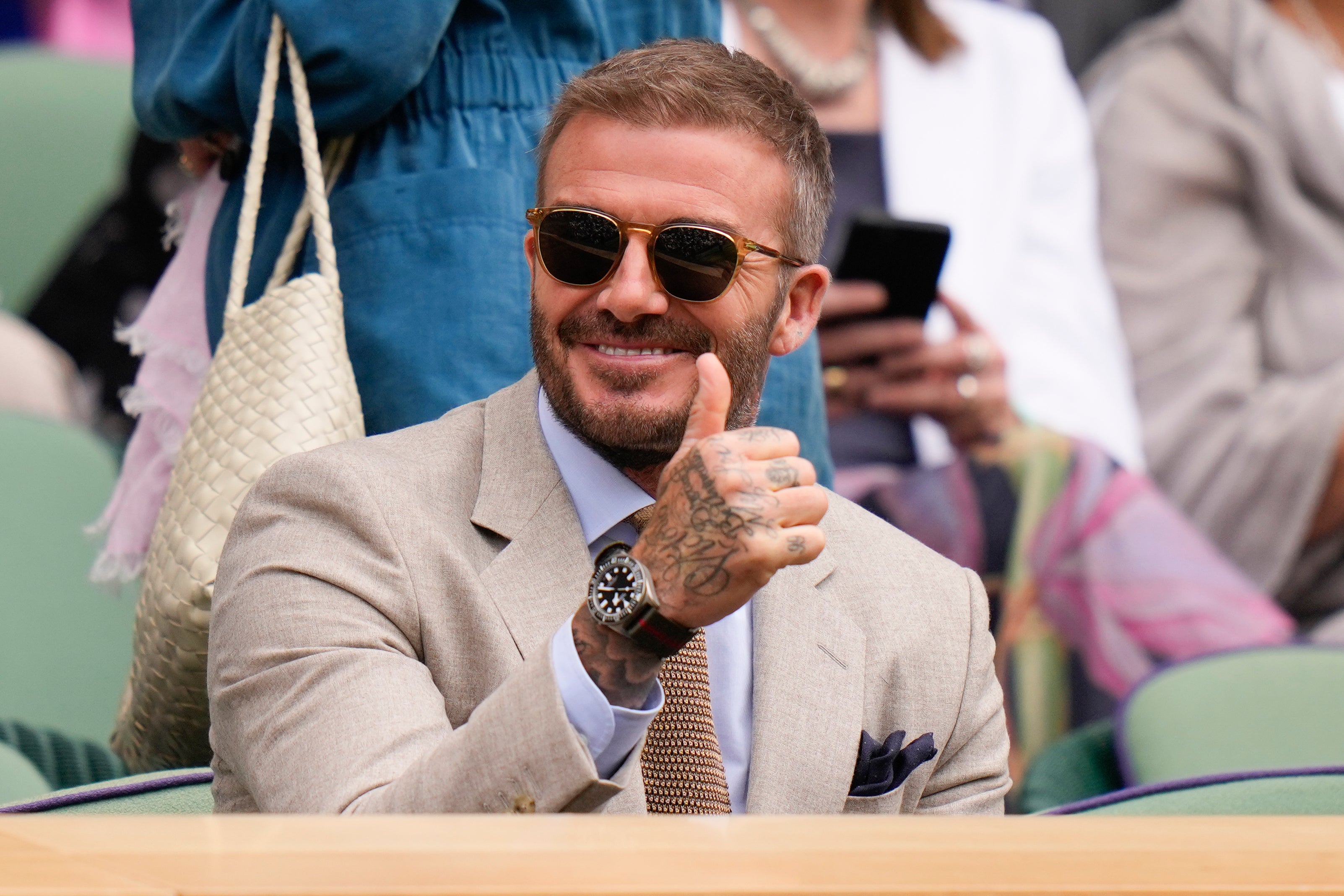 David Beckham was all smiles at Wimbledon.