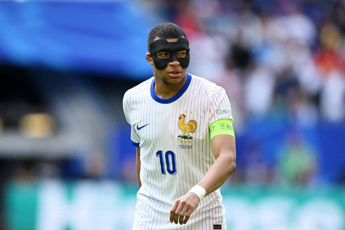 Why is Kylian Mbappe wearing a mask for France against Belgium at Euro 2024?
