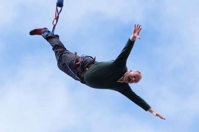 Liberal Democrat leader Sir Ed Davey taking part in a bungee jump (Gareth Fuller/PA)