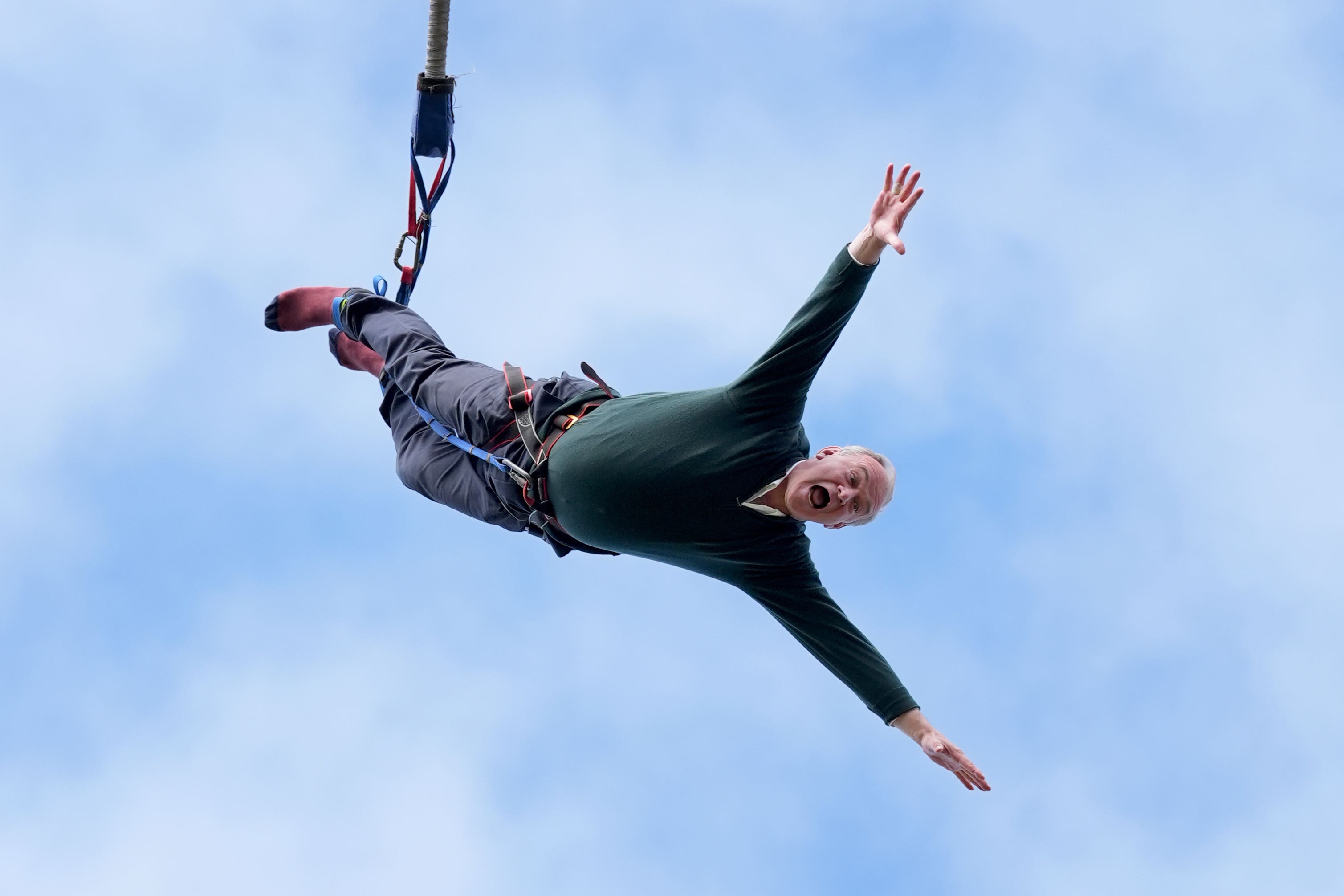 Liberal Democrat leader Ed Davey taking part in a bungee jump