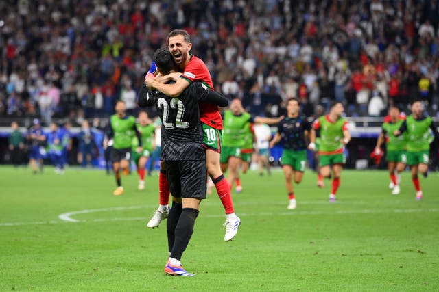 <p>Bernardo Silva celebrates with Diogo Costa</p>