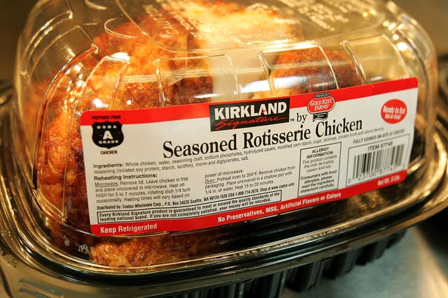 <p>A Kirkland Signature premium brand roasted rotisserie chicken sits at a Costco store in Niles, Illinois. Changes are coming to the popular product </p>