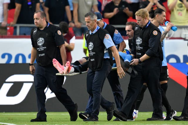 <p>Uruguayan player Maximiliano Araujo is taken off the field on a stretcher after his head collided with defender Tim Ream during a match against the US in Group C of the Copa América, on Monday, July 1, 2024, in Kansas City, Missouri</p>