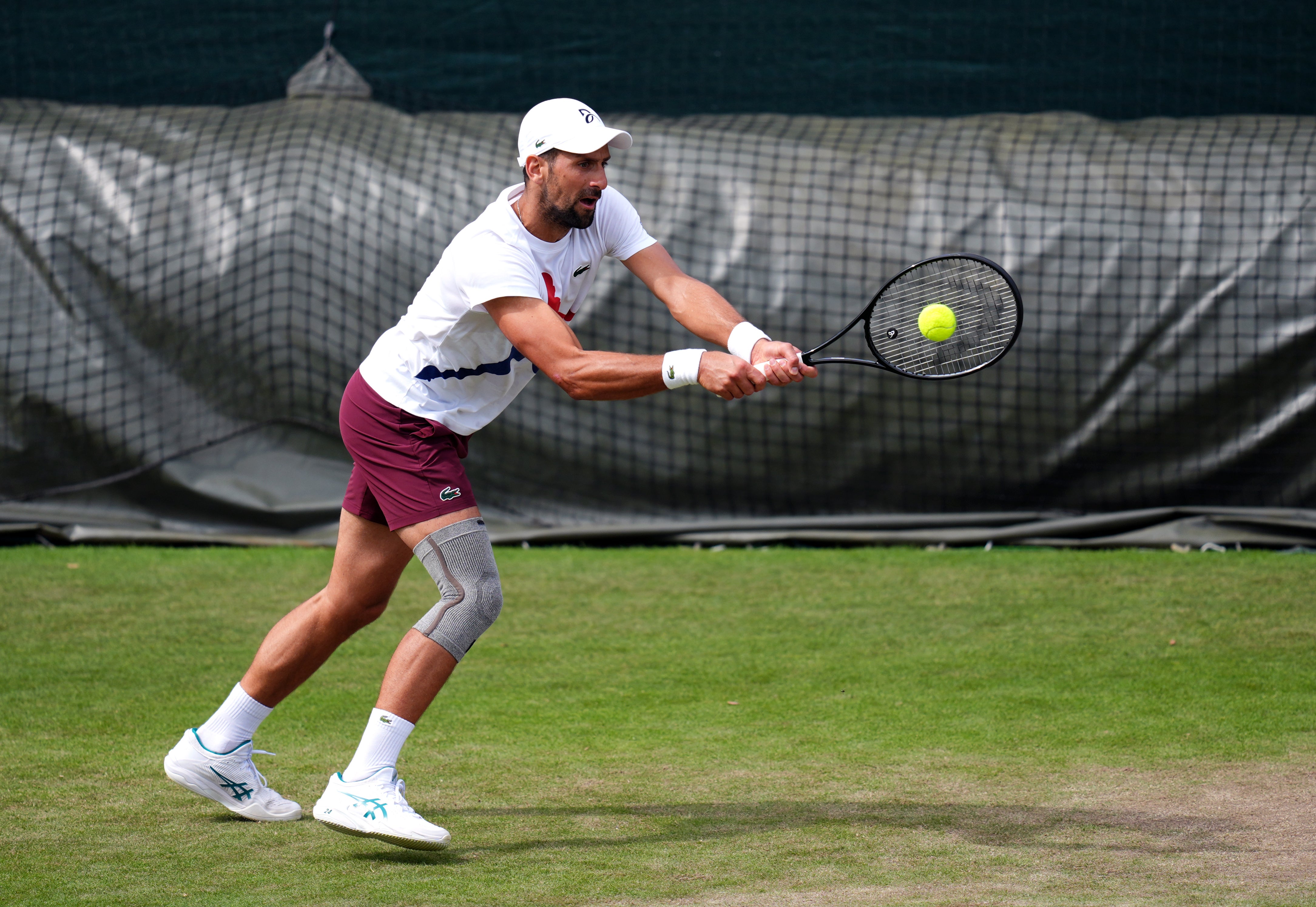 Novak Djokovic wearing strapping on his surgically repaired knee (John Walton/PA)
