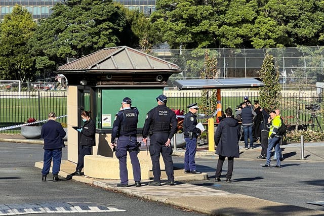 <p>Police officers work at the scene after a 14-year-old boy was arrested and a 22-year-old man was taken to hospital following a stabbing incident at the University of Sydney in Camperdown, Australia, 2 July 2024</p>