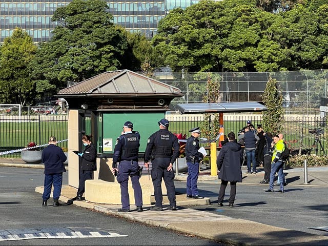 <p>Police officers work at the scene after a 14-year-old boy was arrested and a 22-year-old man was taken to hospital following a stabbing incident at the University of Sydney in Camperdown, Australia, 2 July 2024</p>