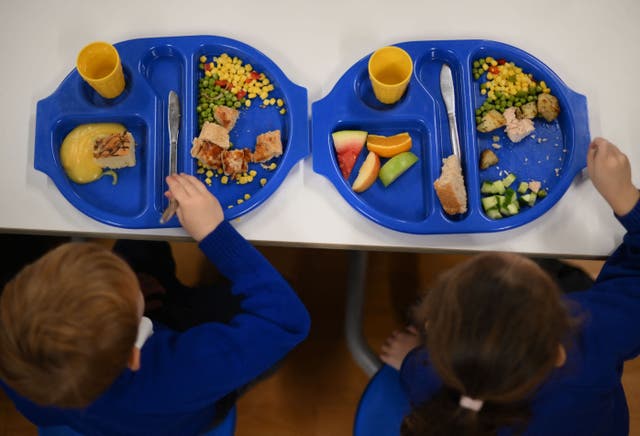 <p>Children eat during lunch-break at St Mary’s RC Primary School, in Battersea, south London, on November 29, 2022</p>