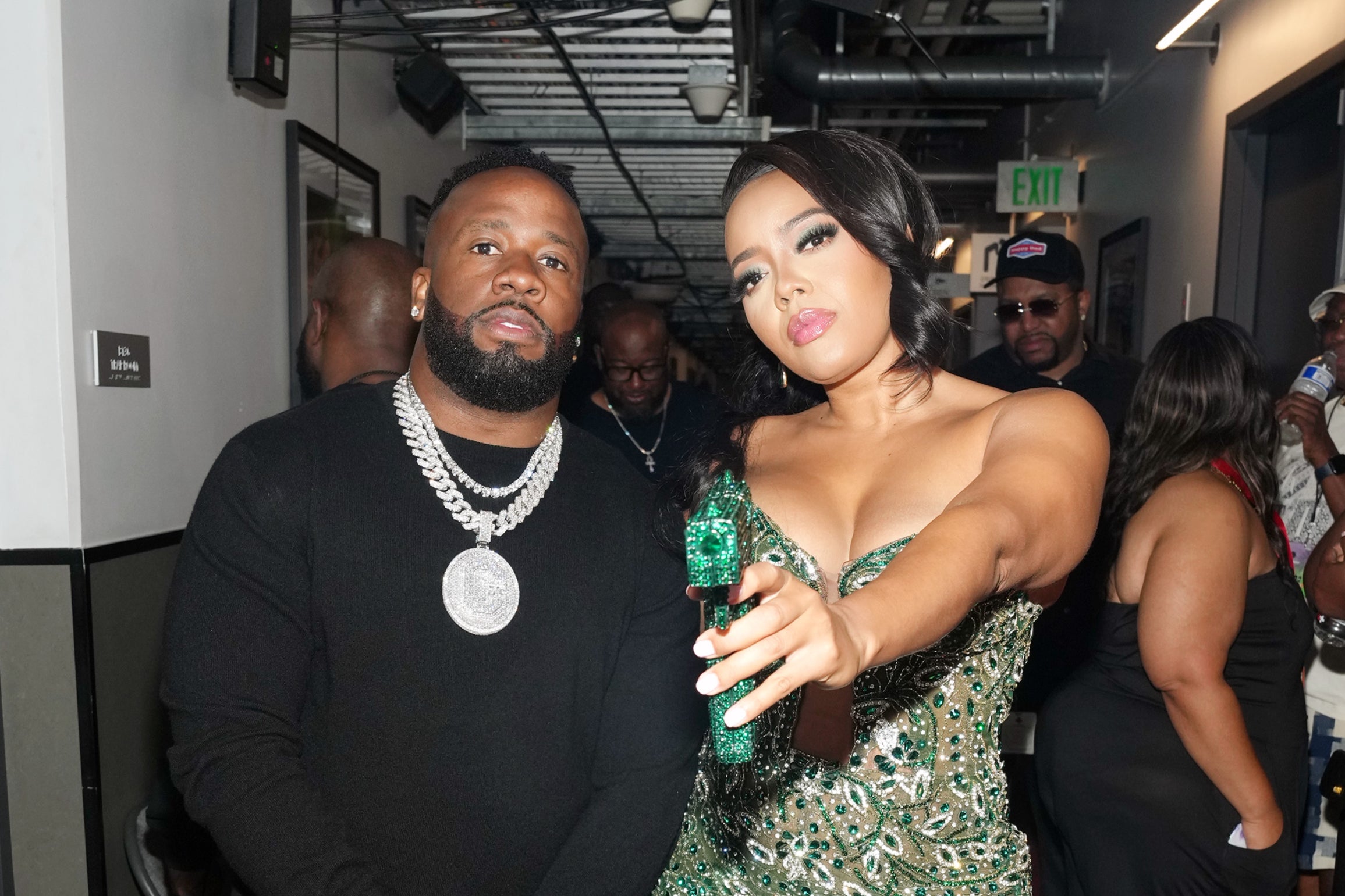 Simmons posing with her purse and boyfriend, rapper Yo Gotti, at the BET awards