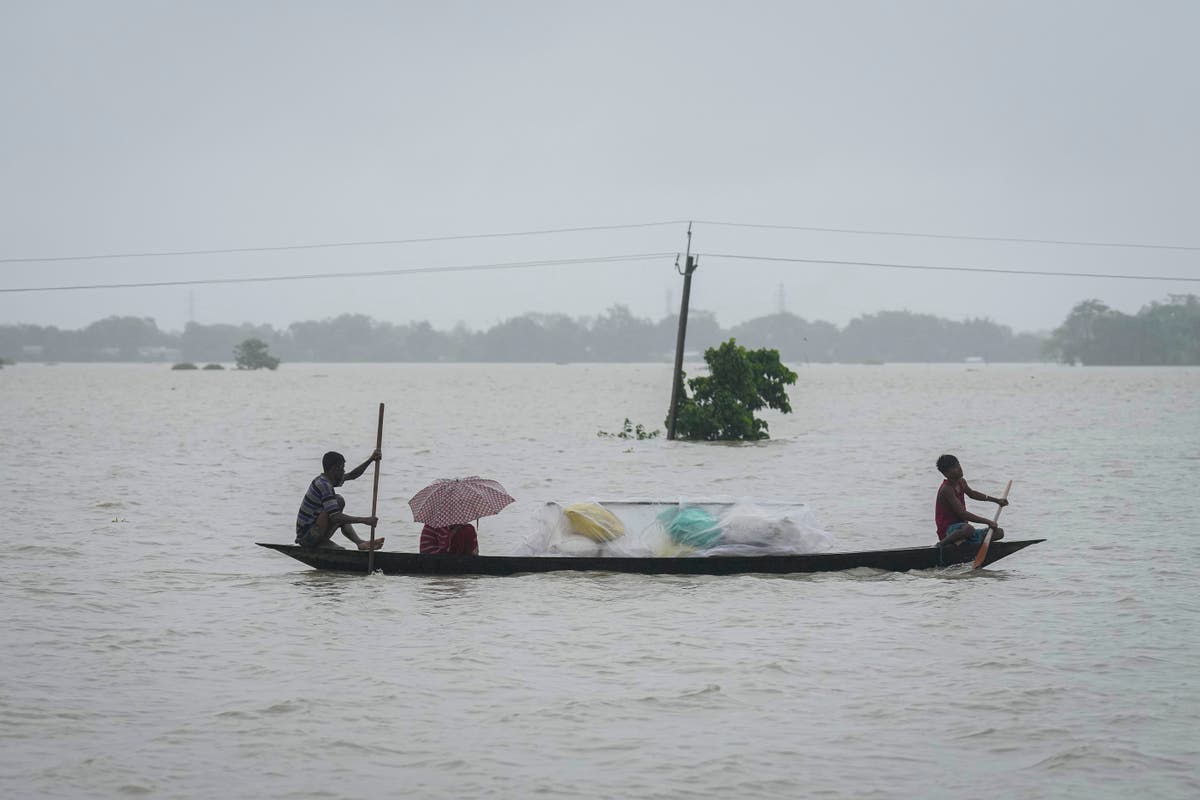 Floods and landslides triggered by heavy rains in India's northeast kill at least 16 people