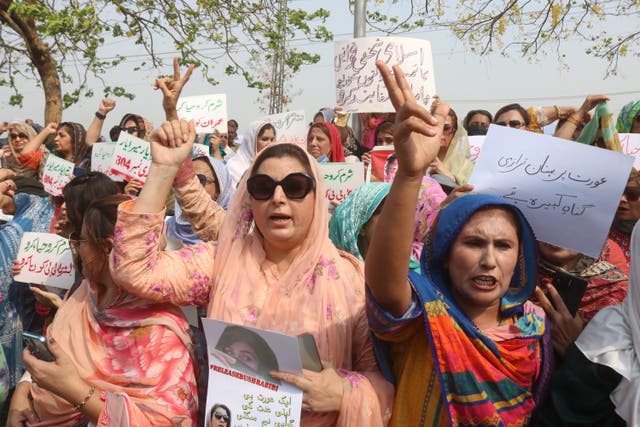 <p>File: Supporters of former prime minister Imran Khan and founder of the opposition Pakistan Tehreek-e-Insaf (PTI) party hold placards outside a court after it upheld the sentence in a case involving Khan in alleged unlawful marriage in Islamabad</p>