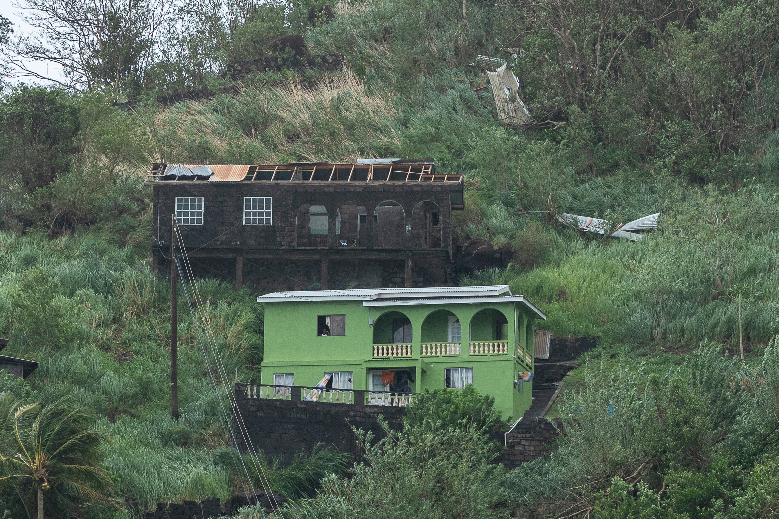 Hurricane Beryl damaged homes, like those pictured, throughout St. Vincent and the Grenadines on Monday