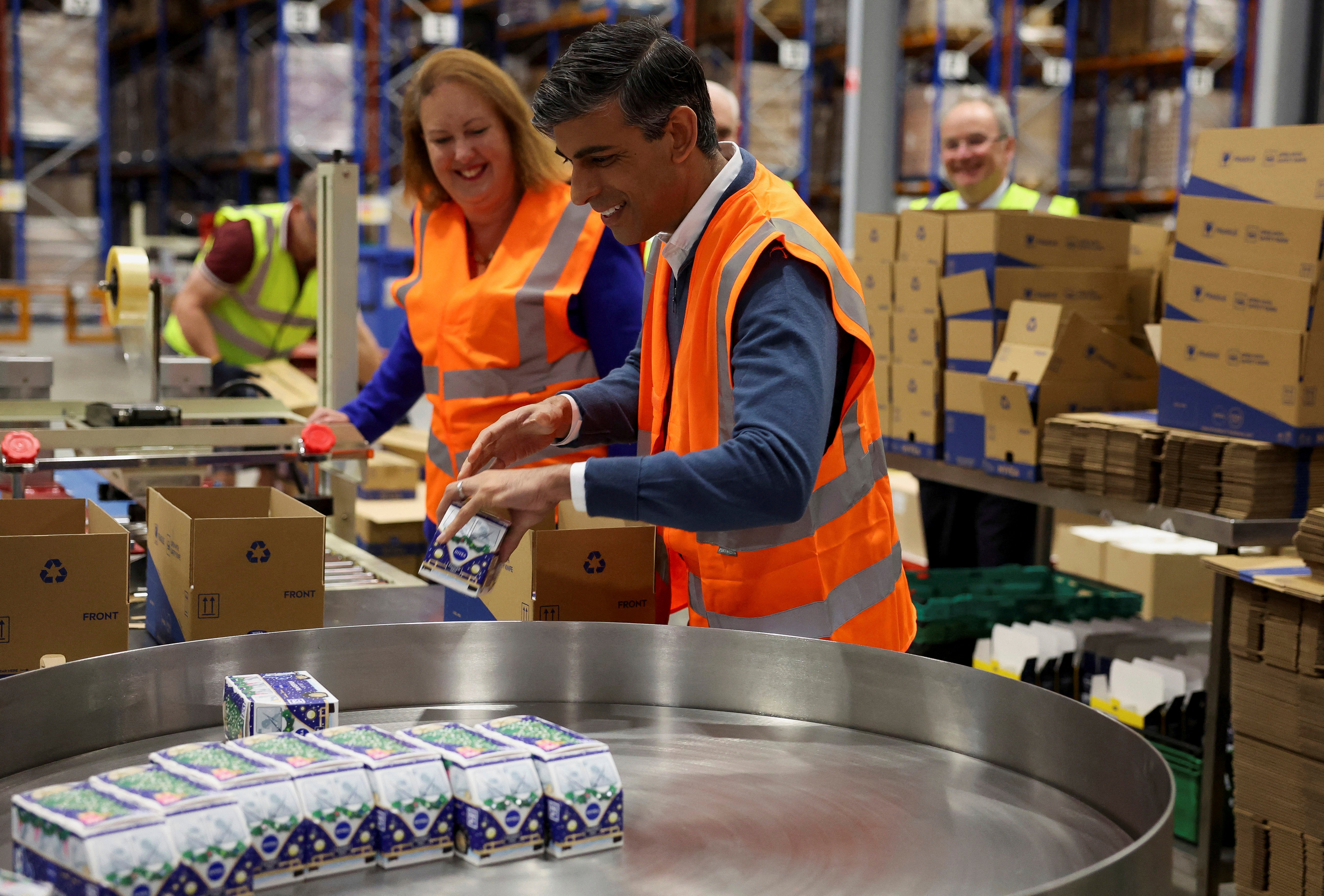 Prime Minister Rishi Sunak helps in packing boxes of Christmas skin care gift sets alongside Conservative Party Candidate for Banbury Victoria Prentis