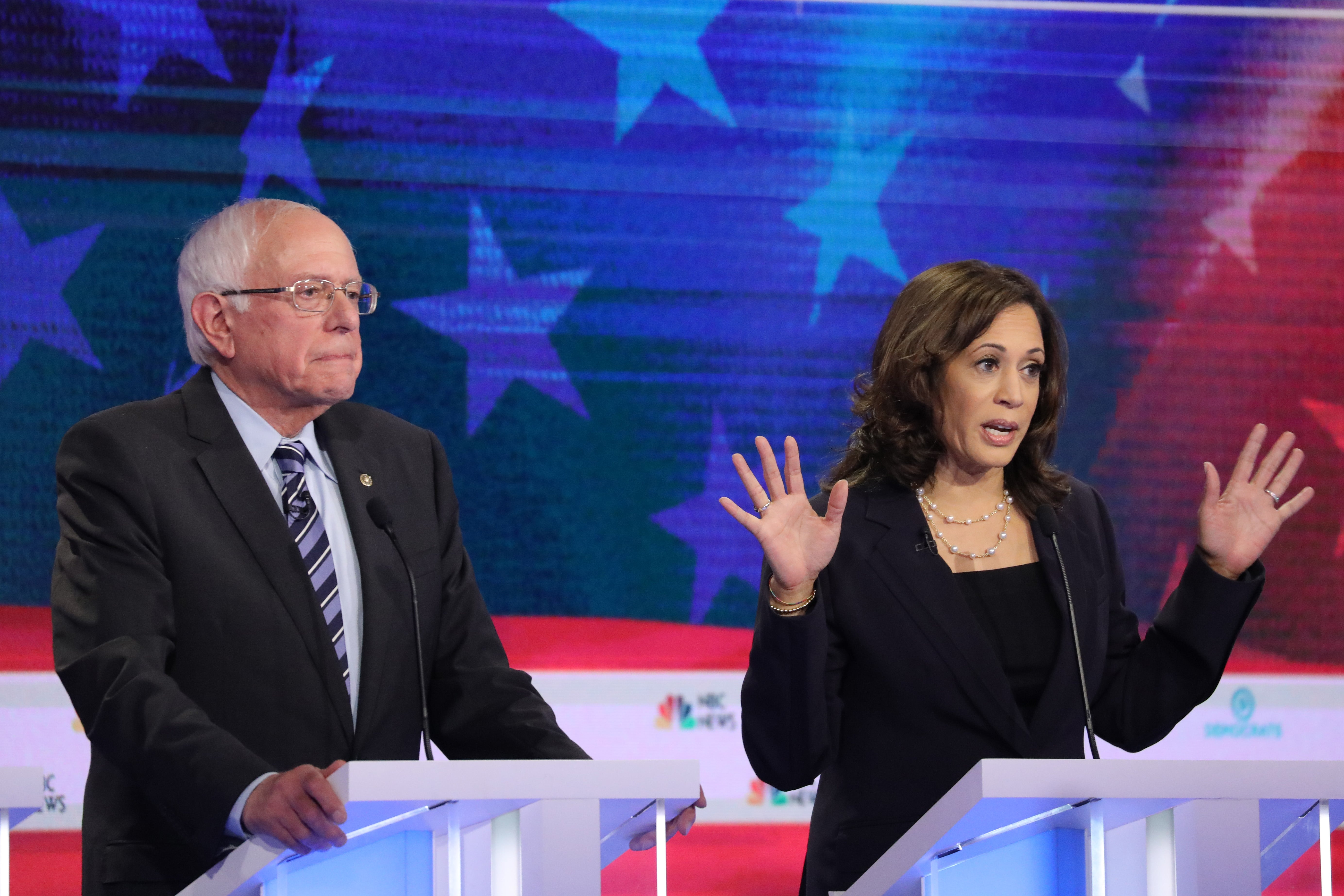 Previous Democratic presidential candidates Bernie Sanders and Kamala Harris take part in the second night of the first Democratic presidential debate on June 27, 2019