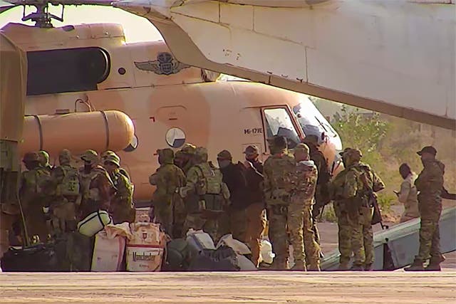 <p>An undated photograph handed out by French forces in April showing Russian mercenaries boarding a helicopter in northern Mali</p>