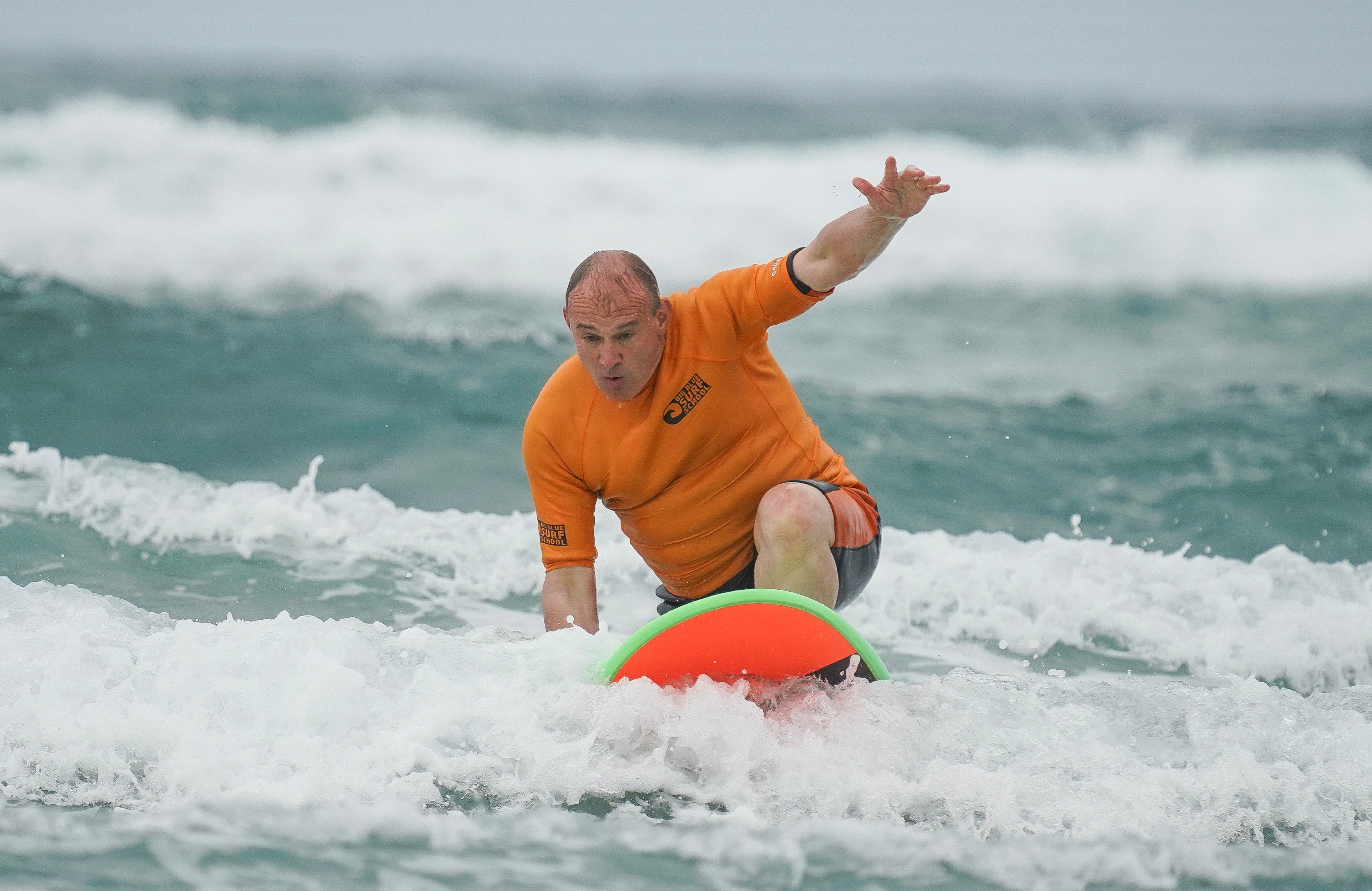 Liberal Democrat leader Sir Ed Davey takes part in a surf session in Bude, Cornwall