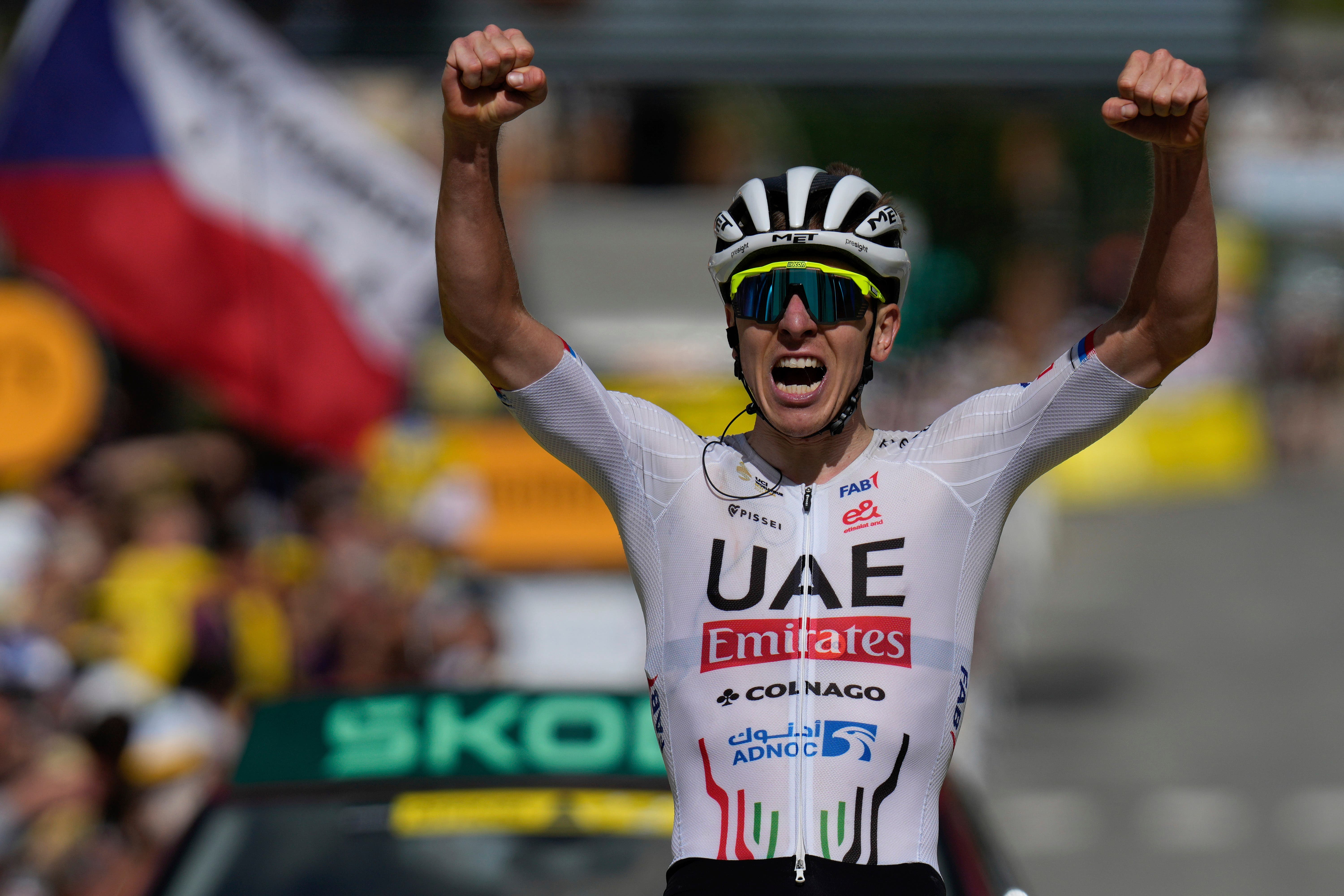Tadej Pogacar won stage four of the Tour de France to move back into the yellow jersey (Jerome Delay/AP)