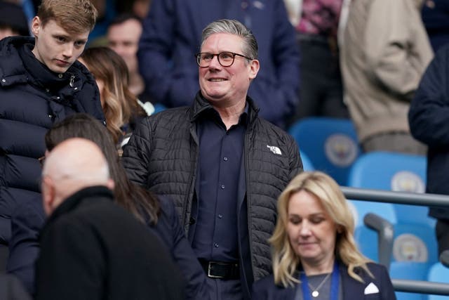 <p>Sir Keir Starmer in the stands watching Arsenal play an away game at Man City earlier this year (Martin Rickett/PA)</p>