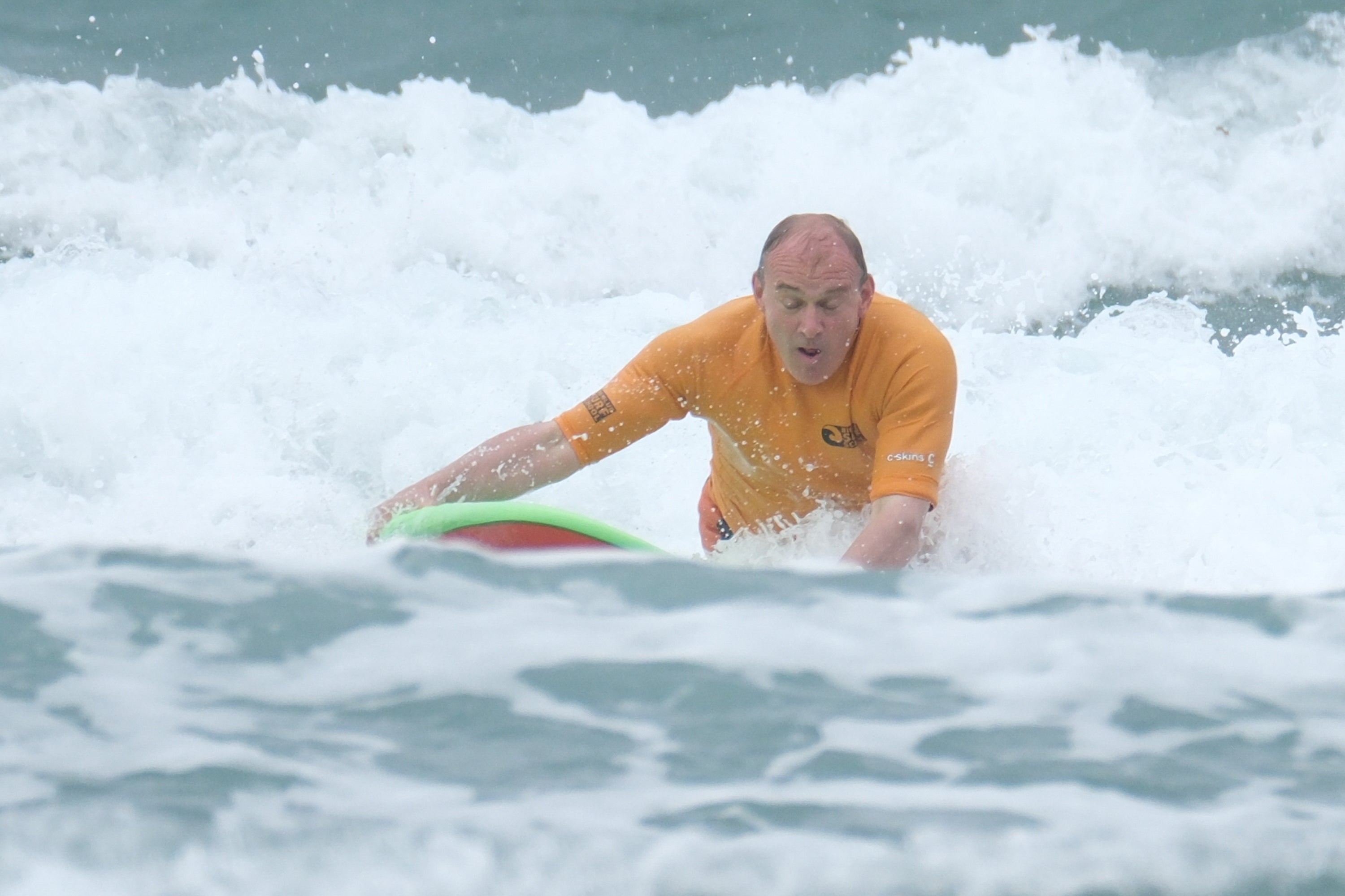 Sir Ed Davey takes on the surf as part of his general election campaign (Matt Keeble/PA)