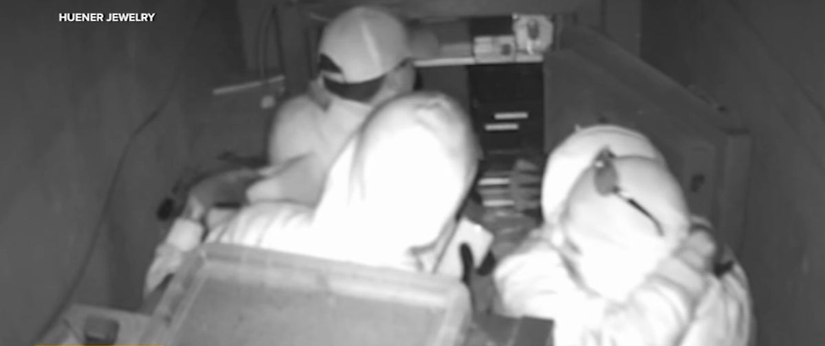 Thieves high-five after cracking the safe during brazen jewelry heist at West Hollywood store