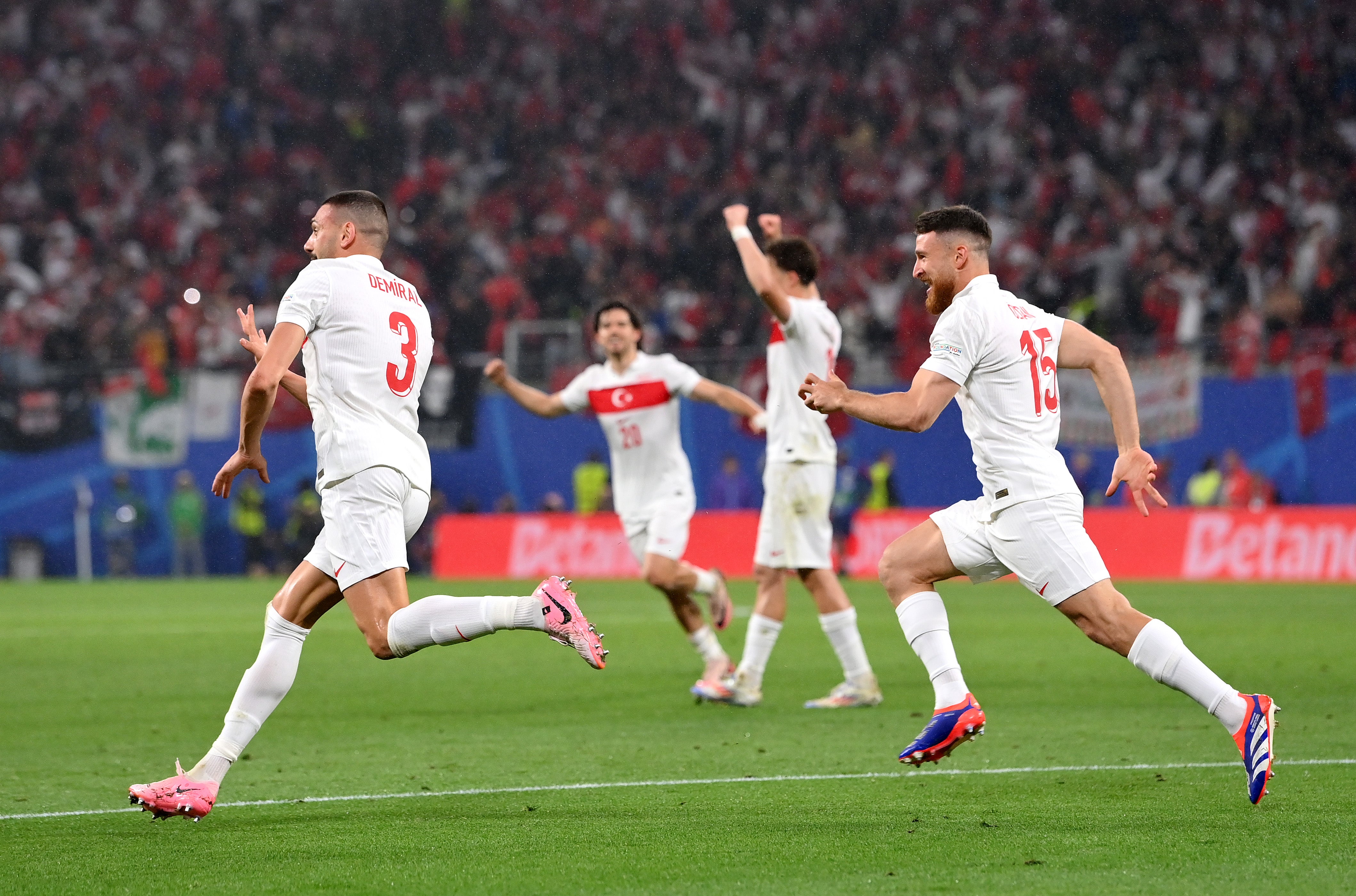 Turkey celebrate the second goal of Merih Demiral, left