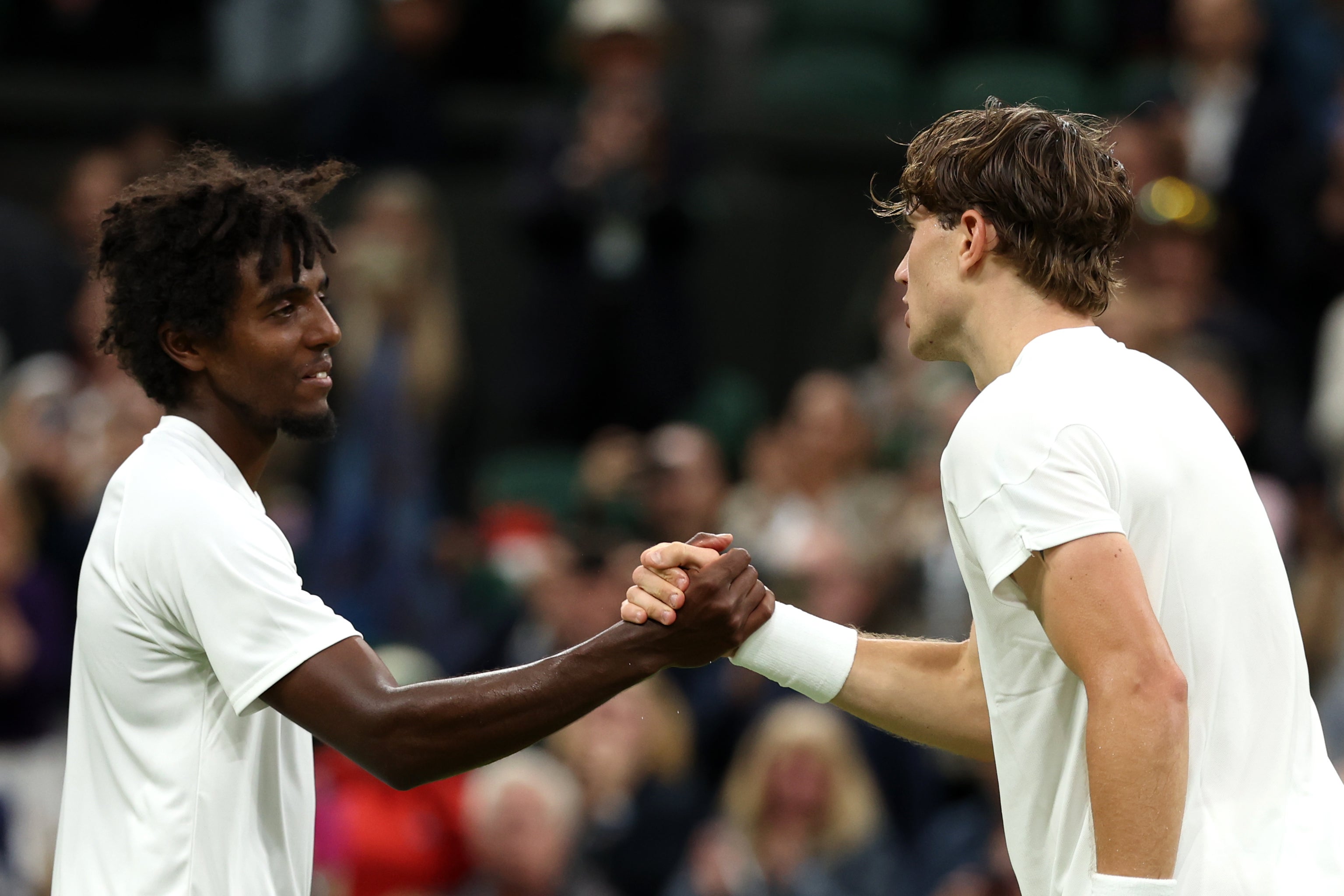 Draper shakes hands with Ymer as the match finished after 9pm